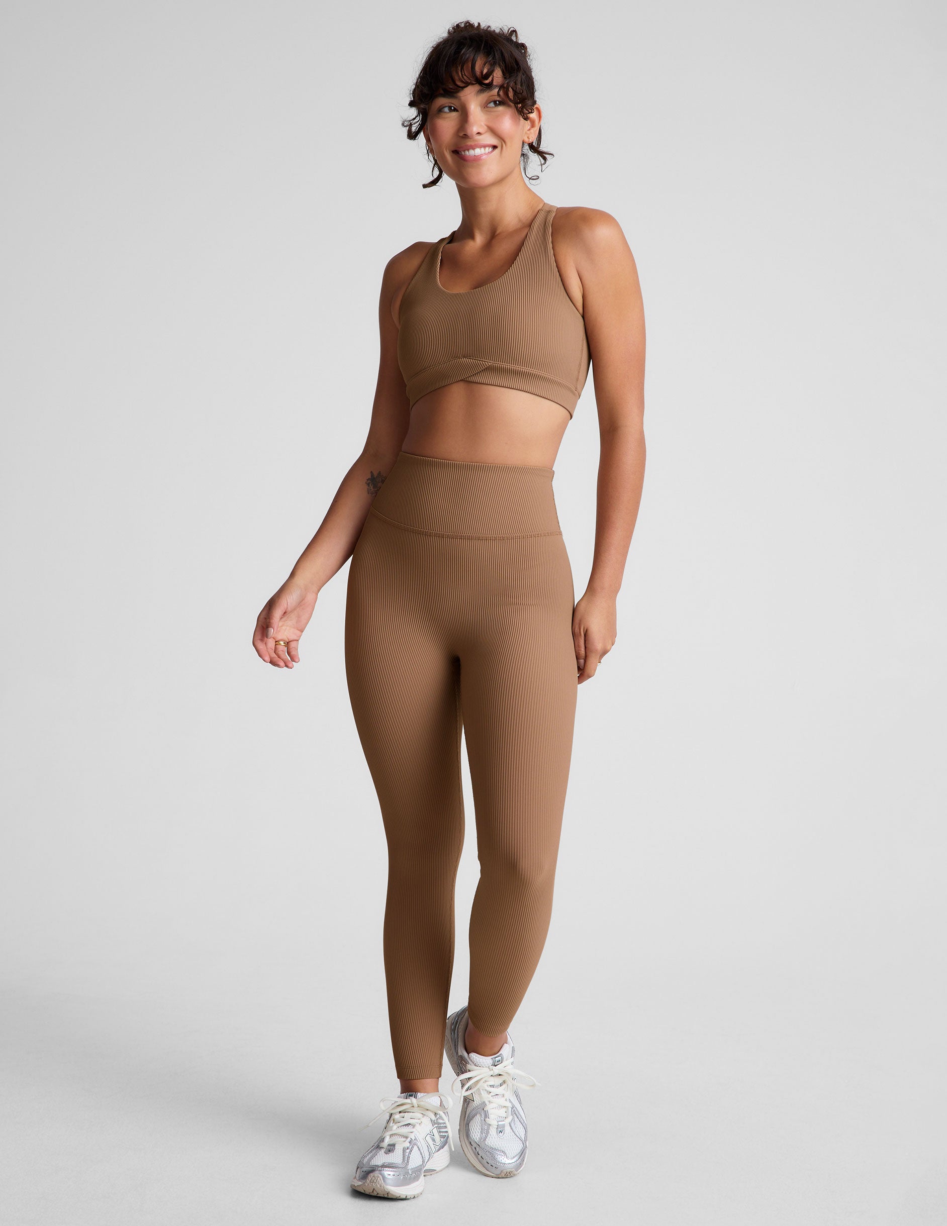 brown midi length leggings with a 4" waistband and no front rise seam.
