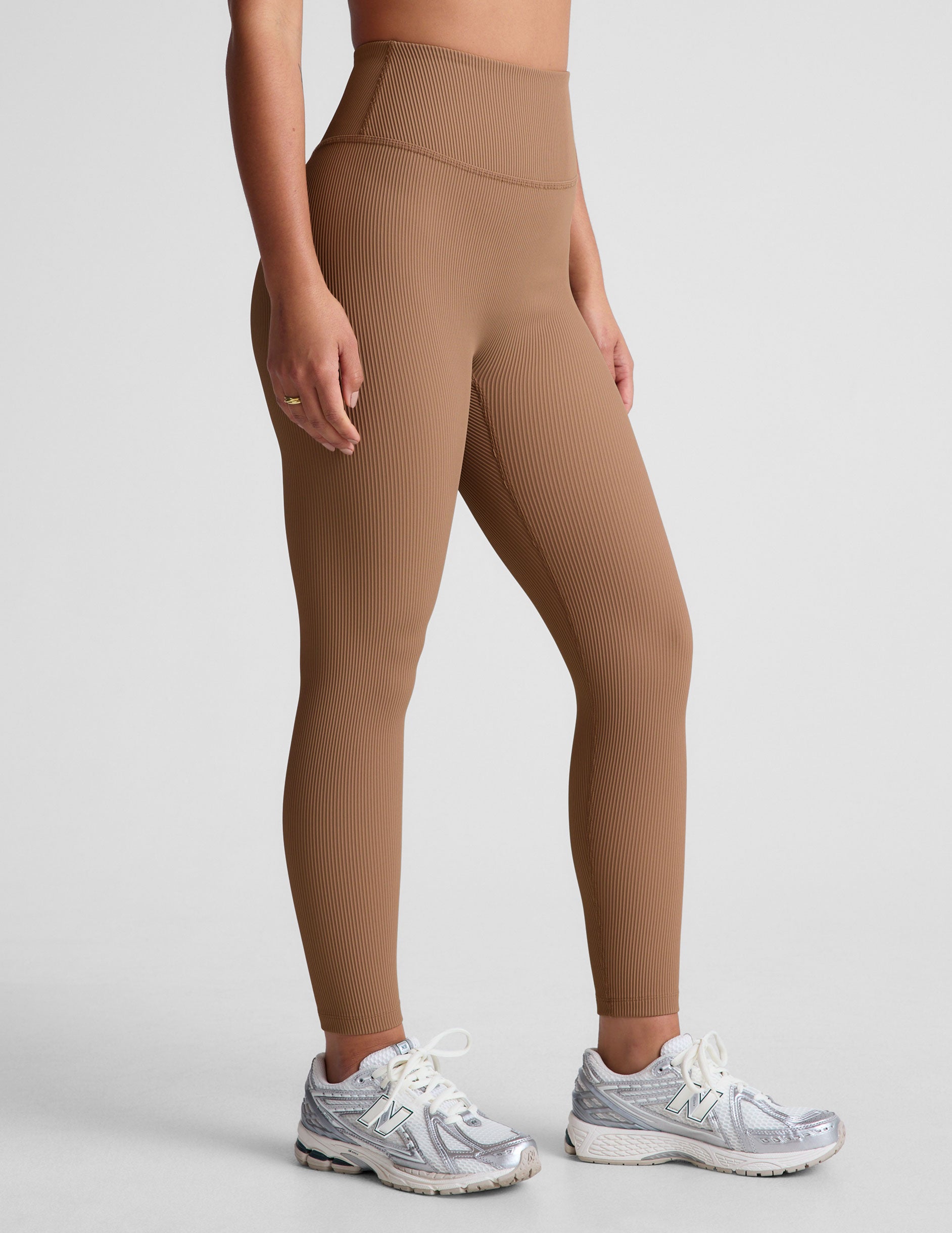 brown midi length leggings with a 4" waistband and no front rise seam.