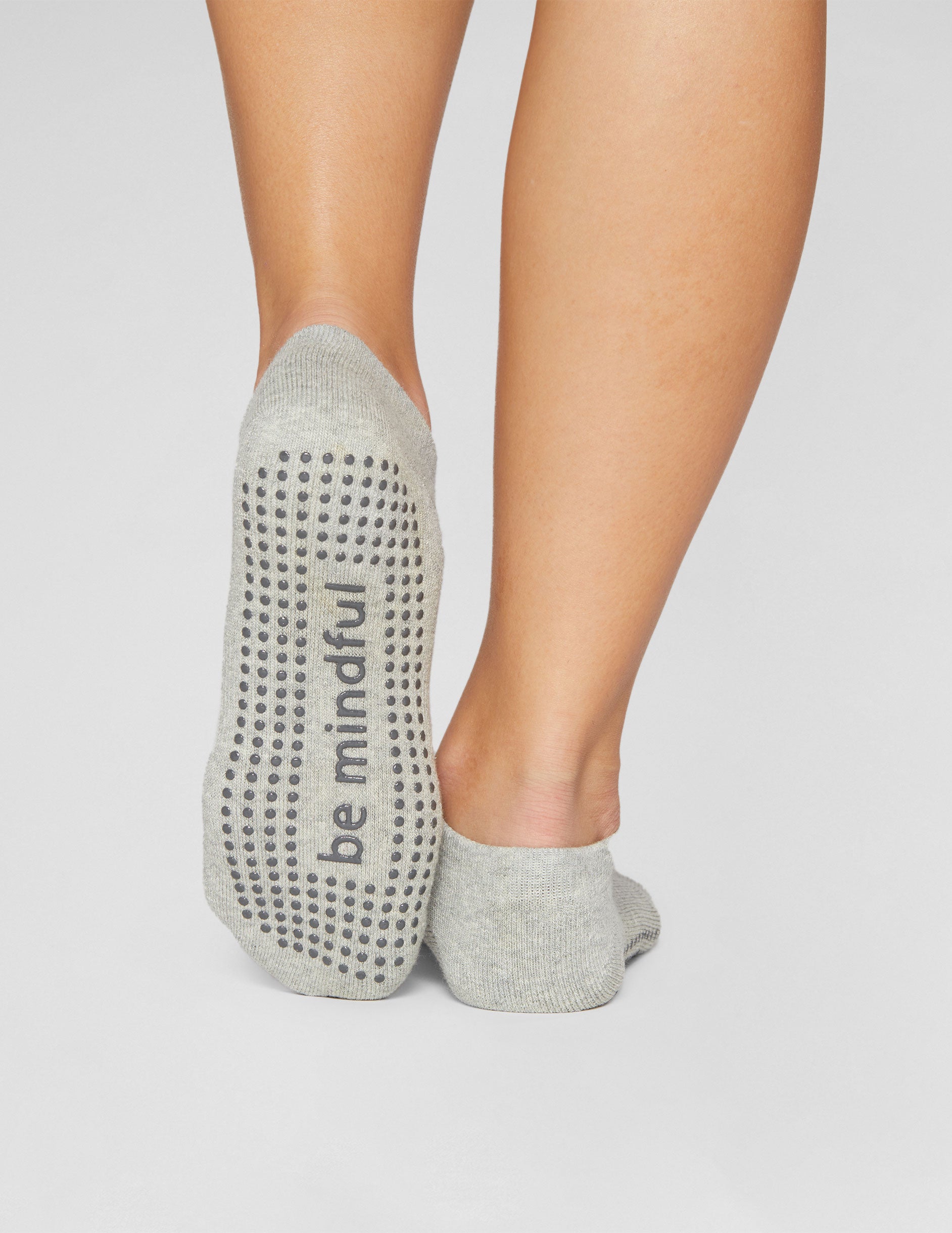 grey ankle grip socks.
