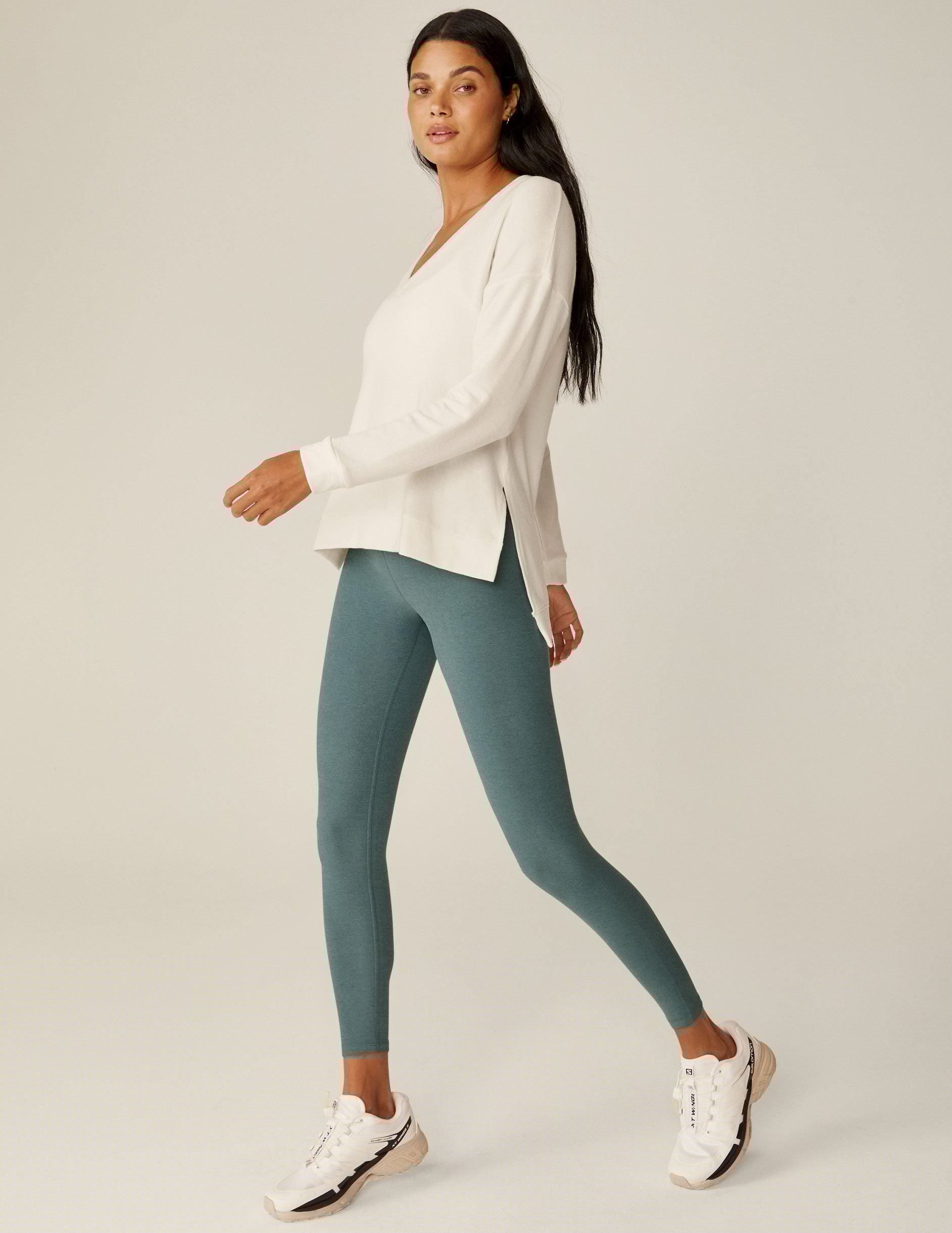 white v-neck pullover sweater with a high low hem.