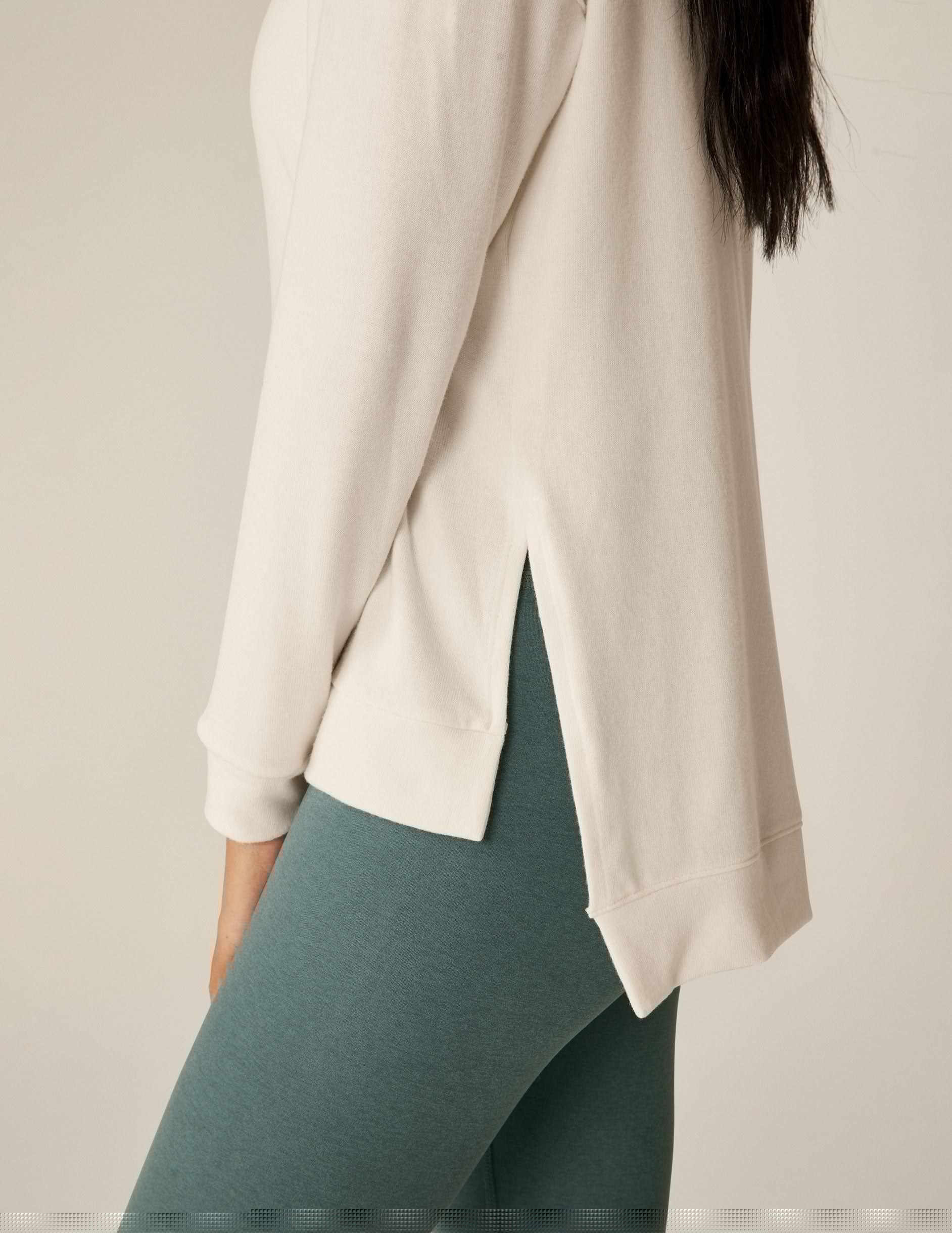 white v-neck pullover sweater with a high low hem.
