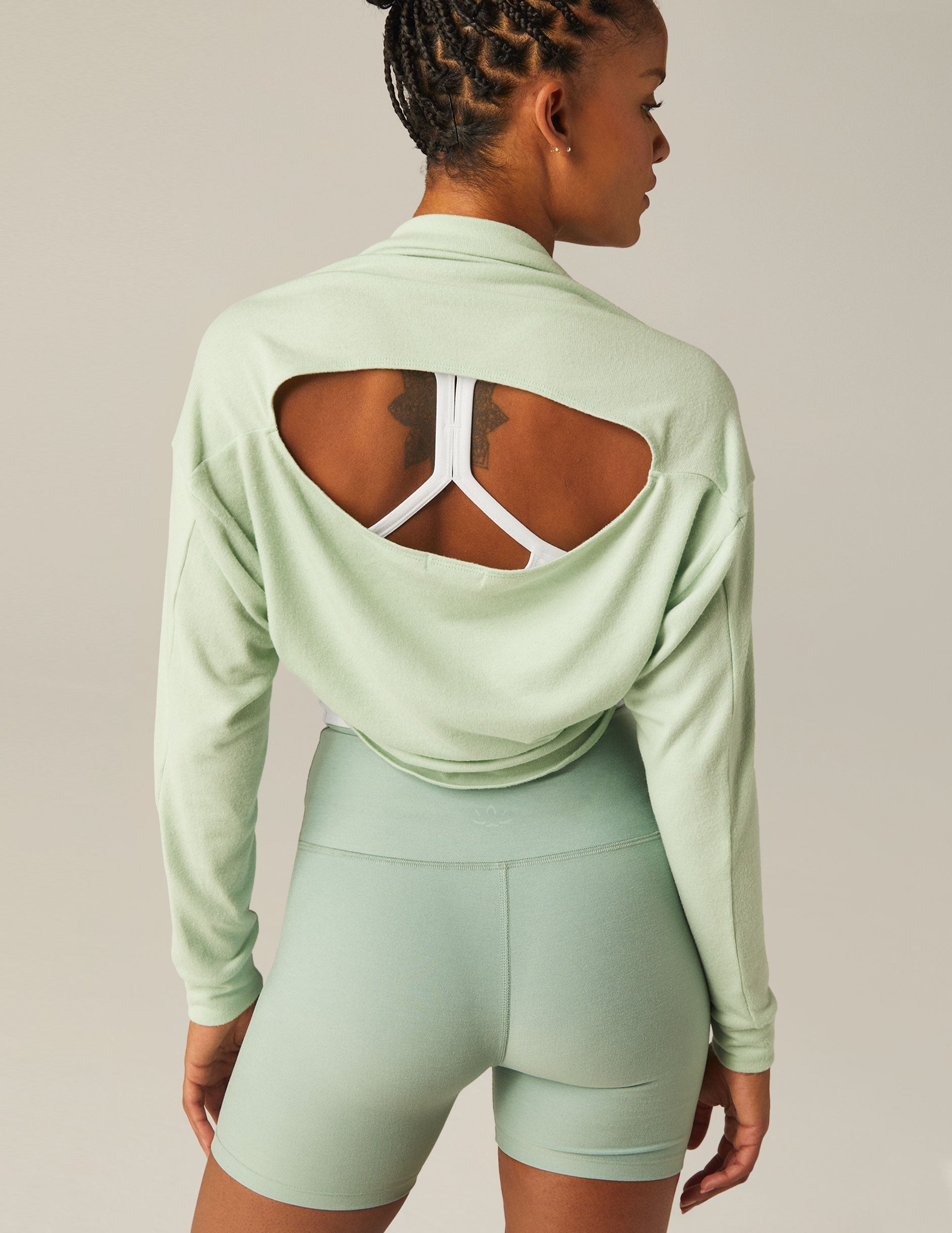 green off the shoulder shrug top with keyhole back.