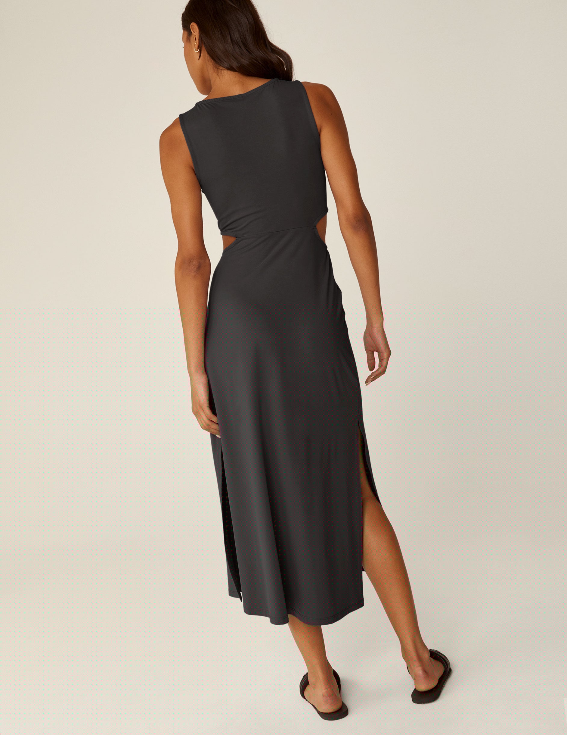 black maxi dress with cutouts at the waist.