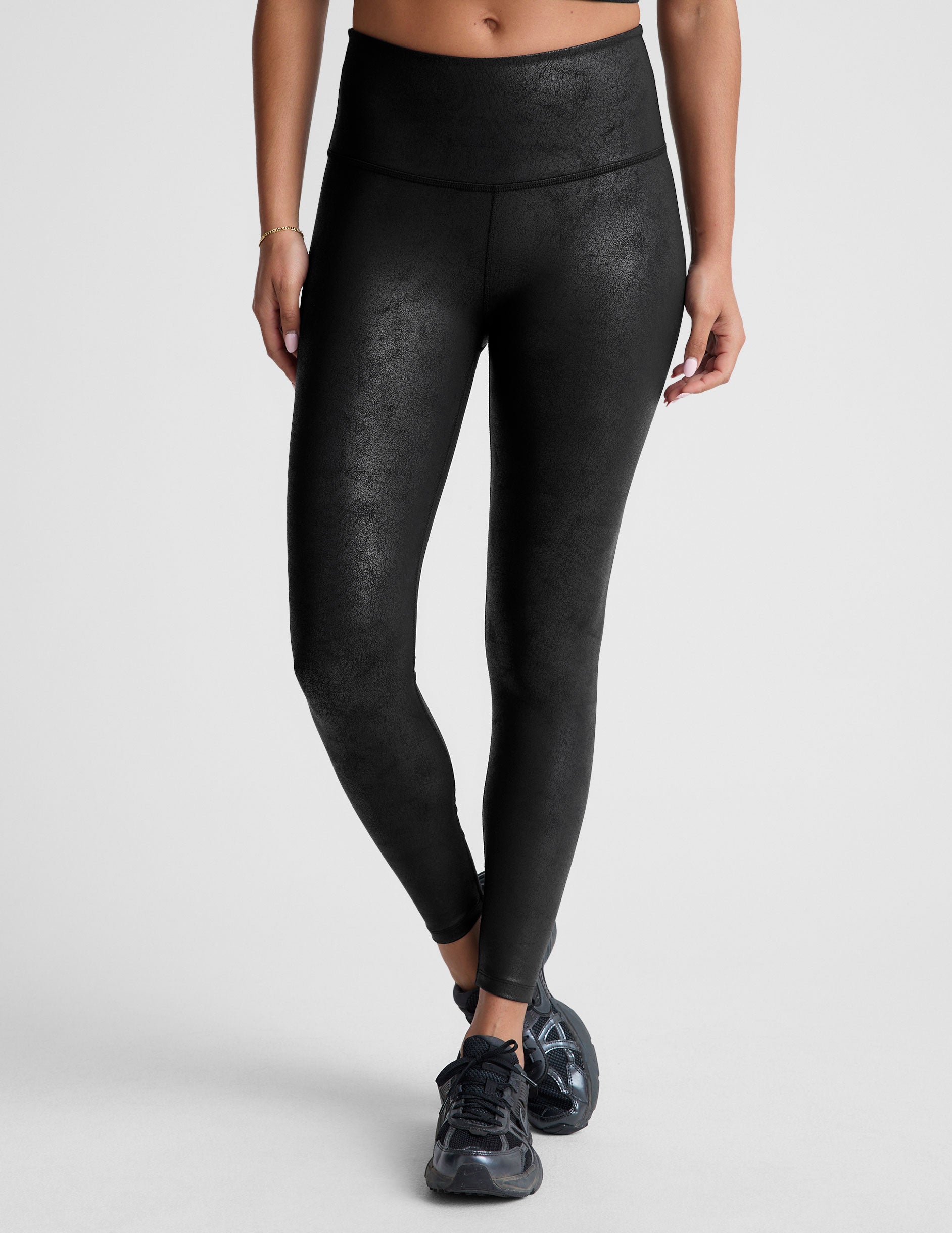 black leather high-waisted midi leggings.