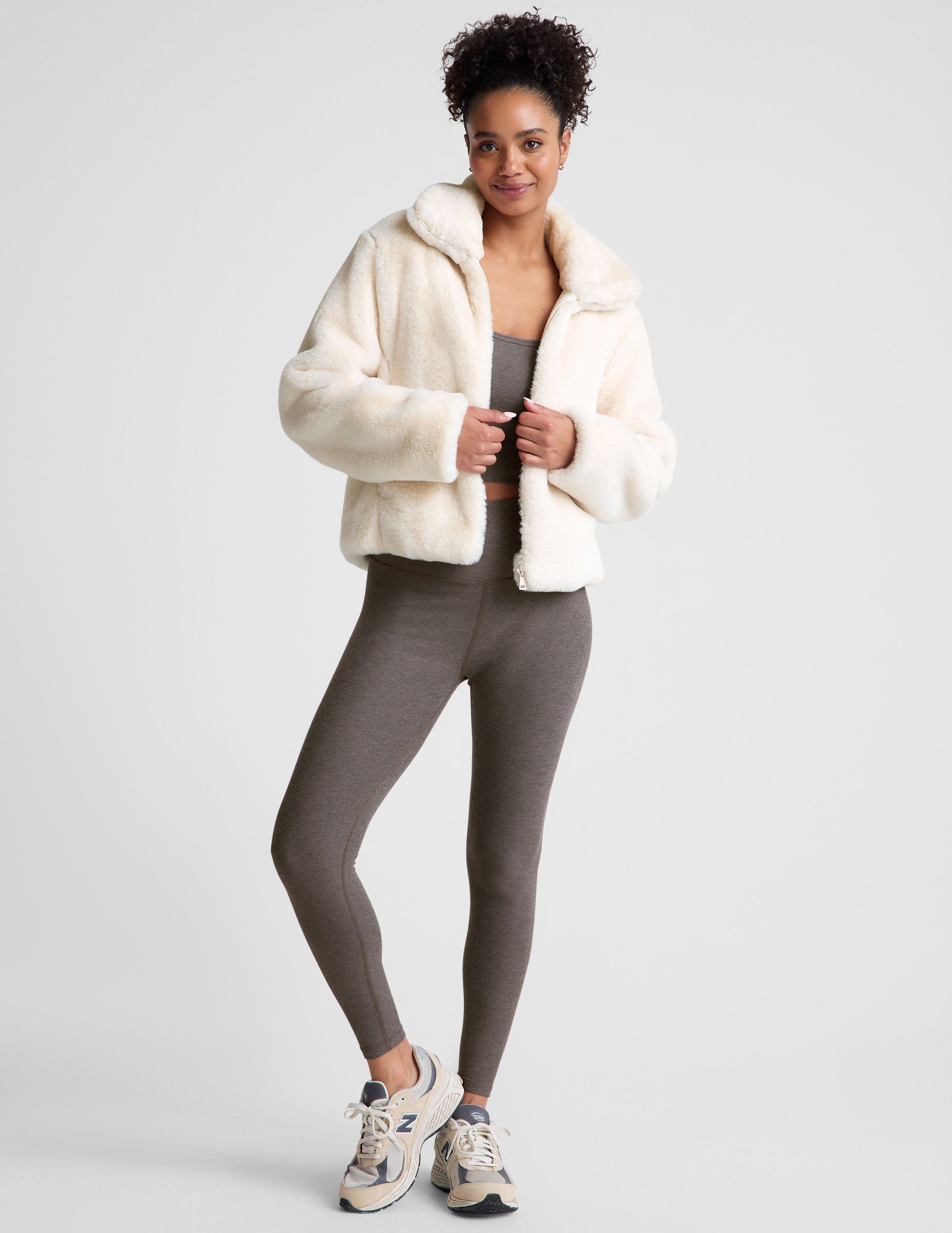 white faux fur zip-up collared jacket.