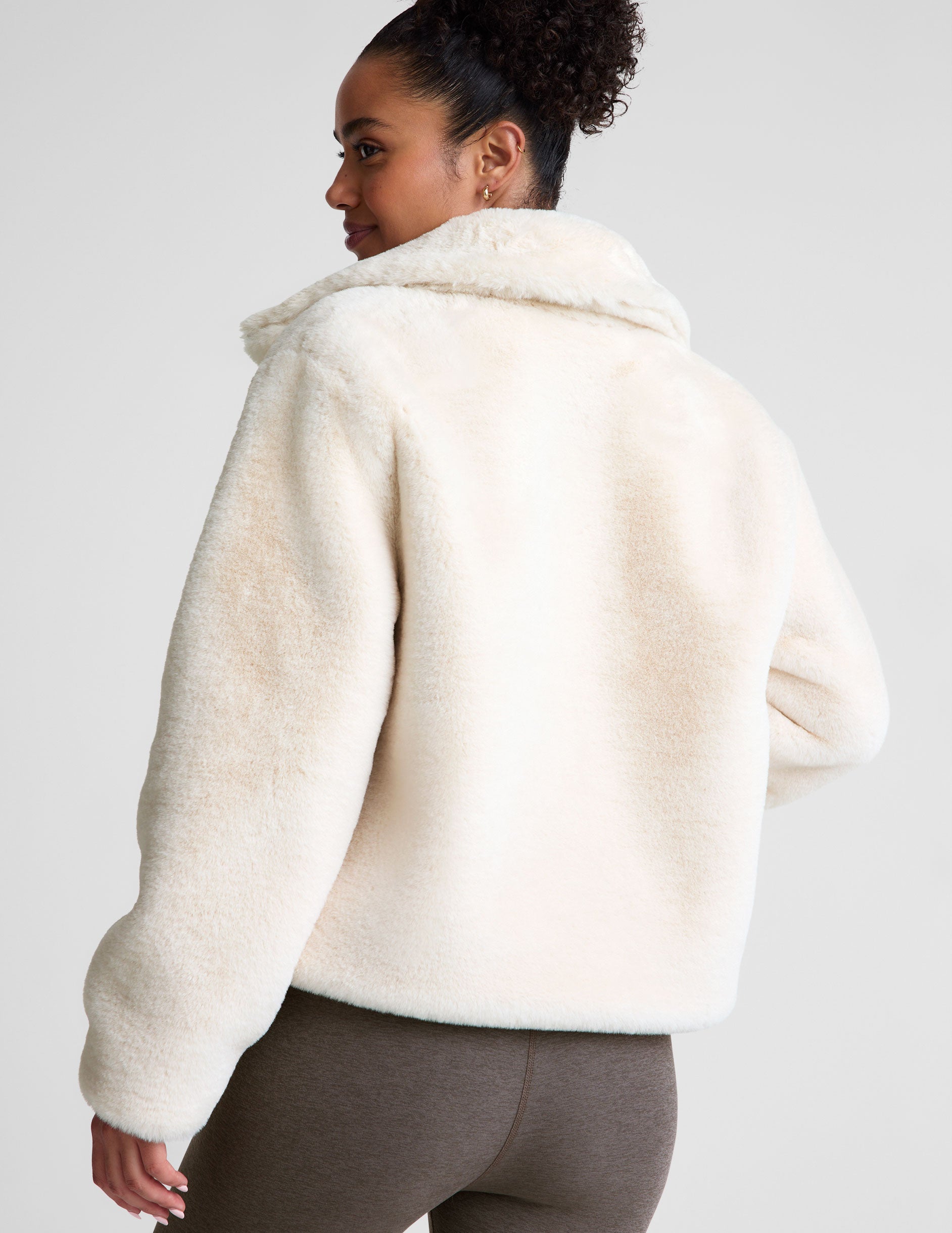 white faux fur zip-up collared jacket.
