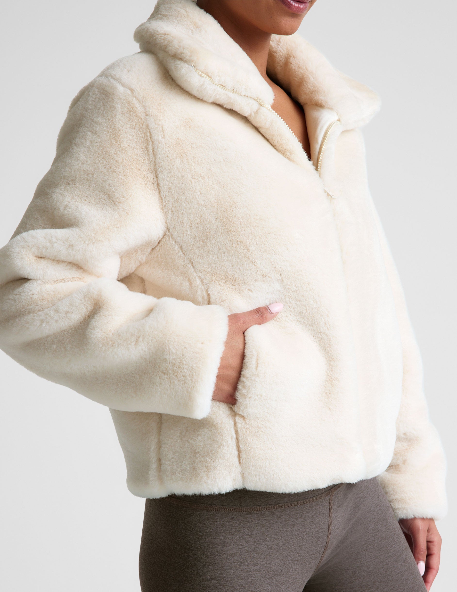 white faux fur zip-up collared jacket.