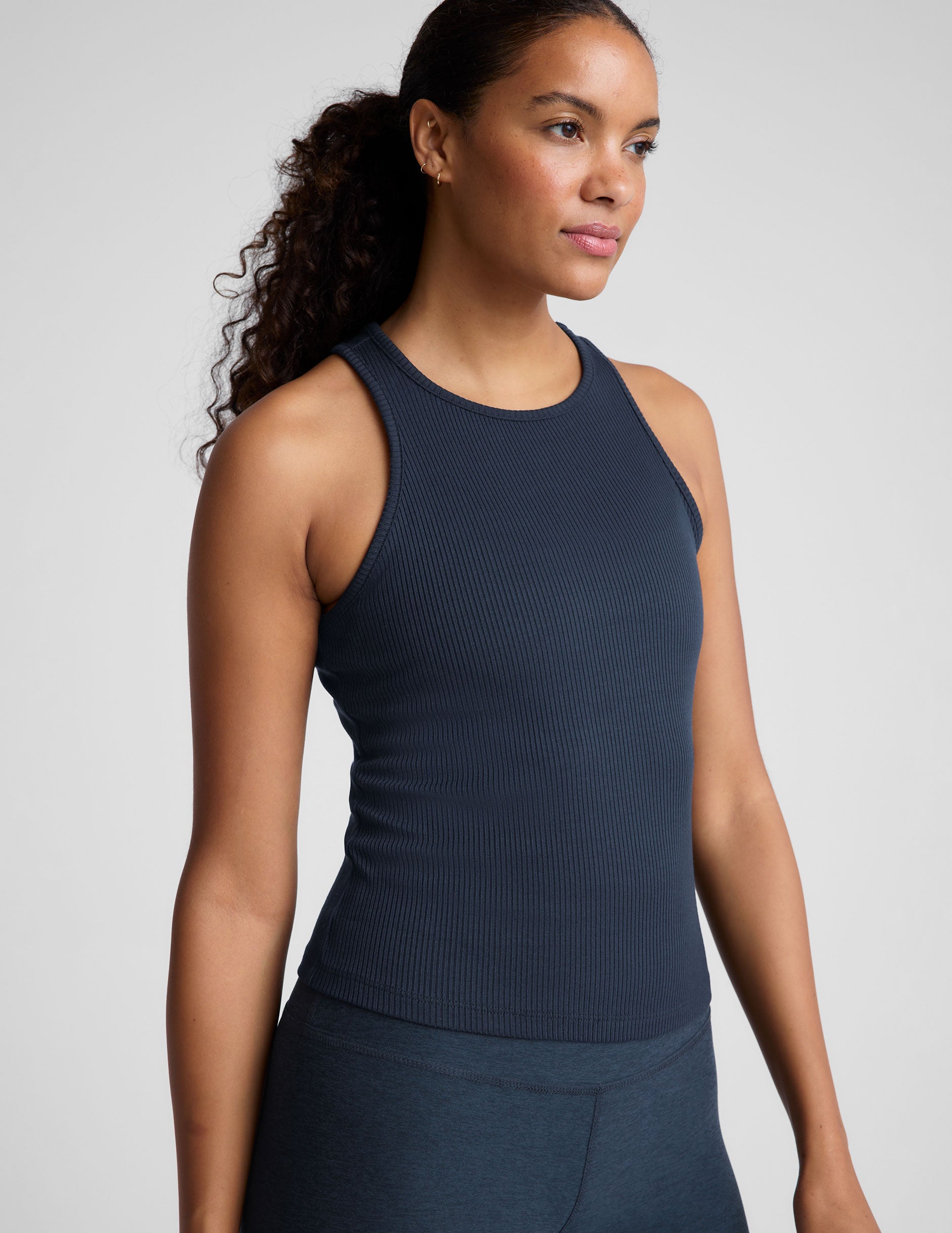 blue ribbed high scoop neckline midway length tank.