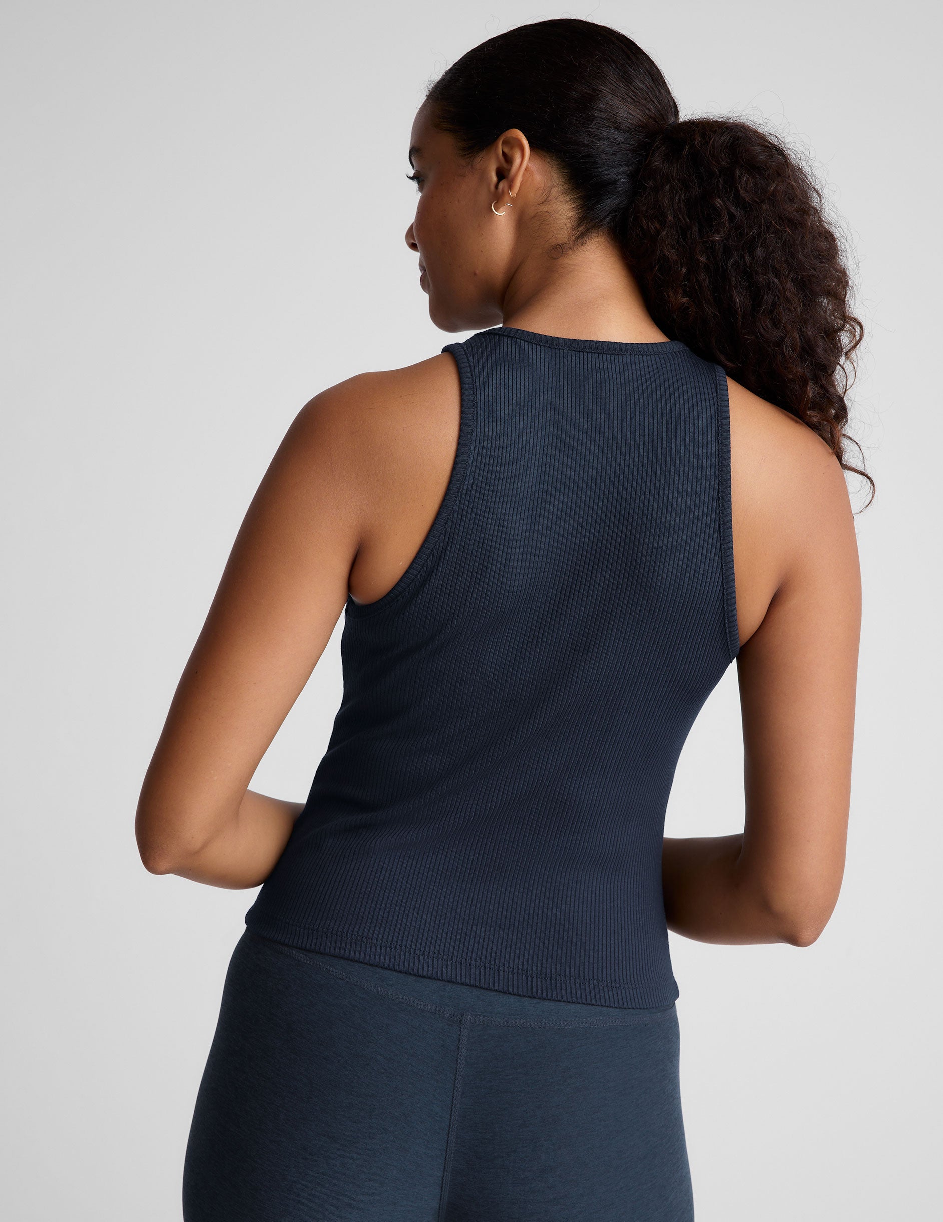 blue ribbed high scoop neckline midway length tank.