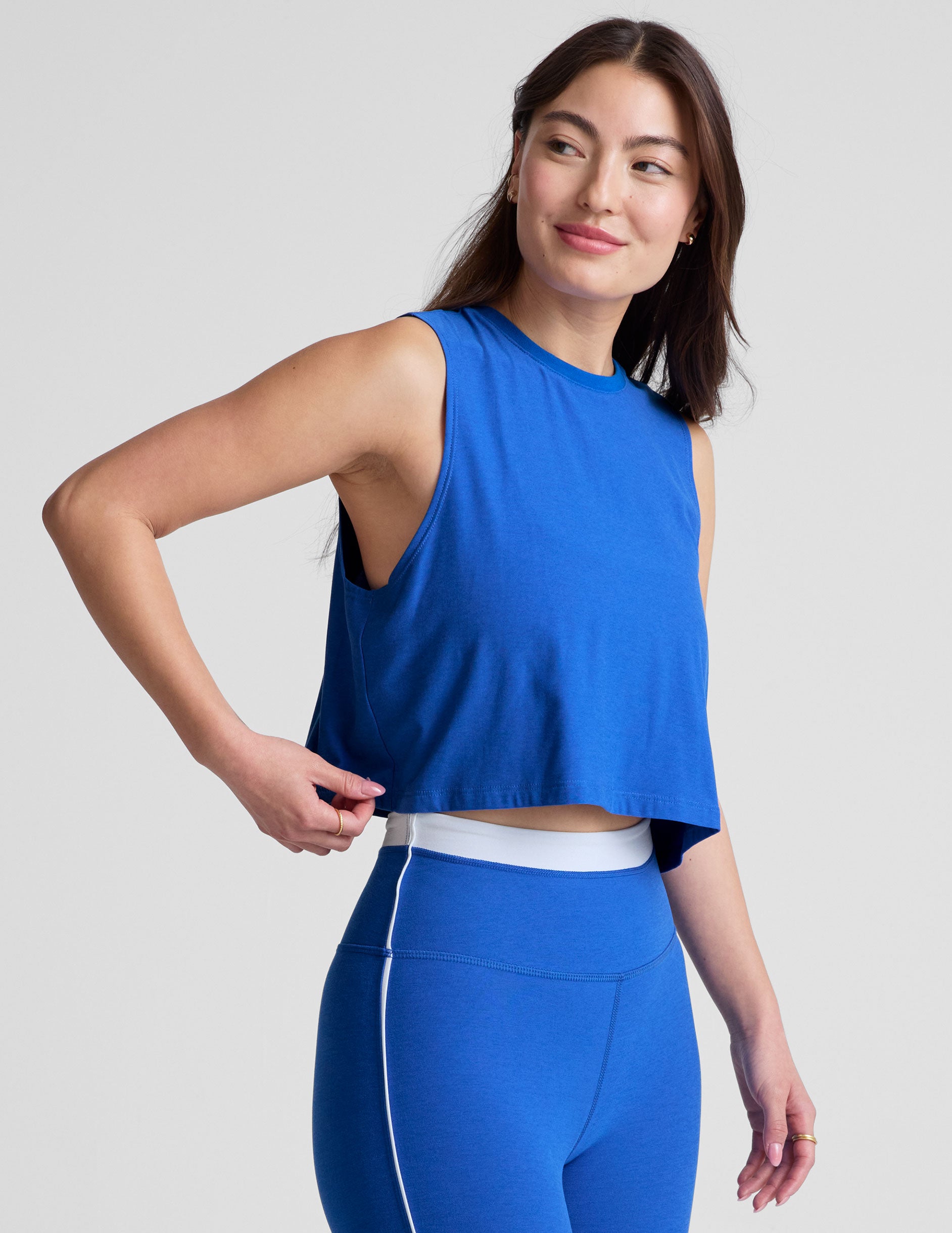 blue relaxed fit cropped tank with a scooped, ribbed neckline and ribbed arm holes.