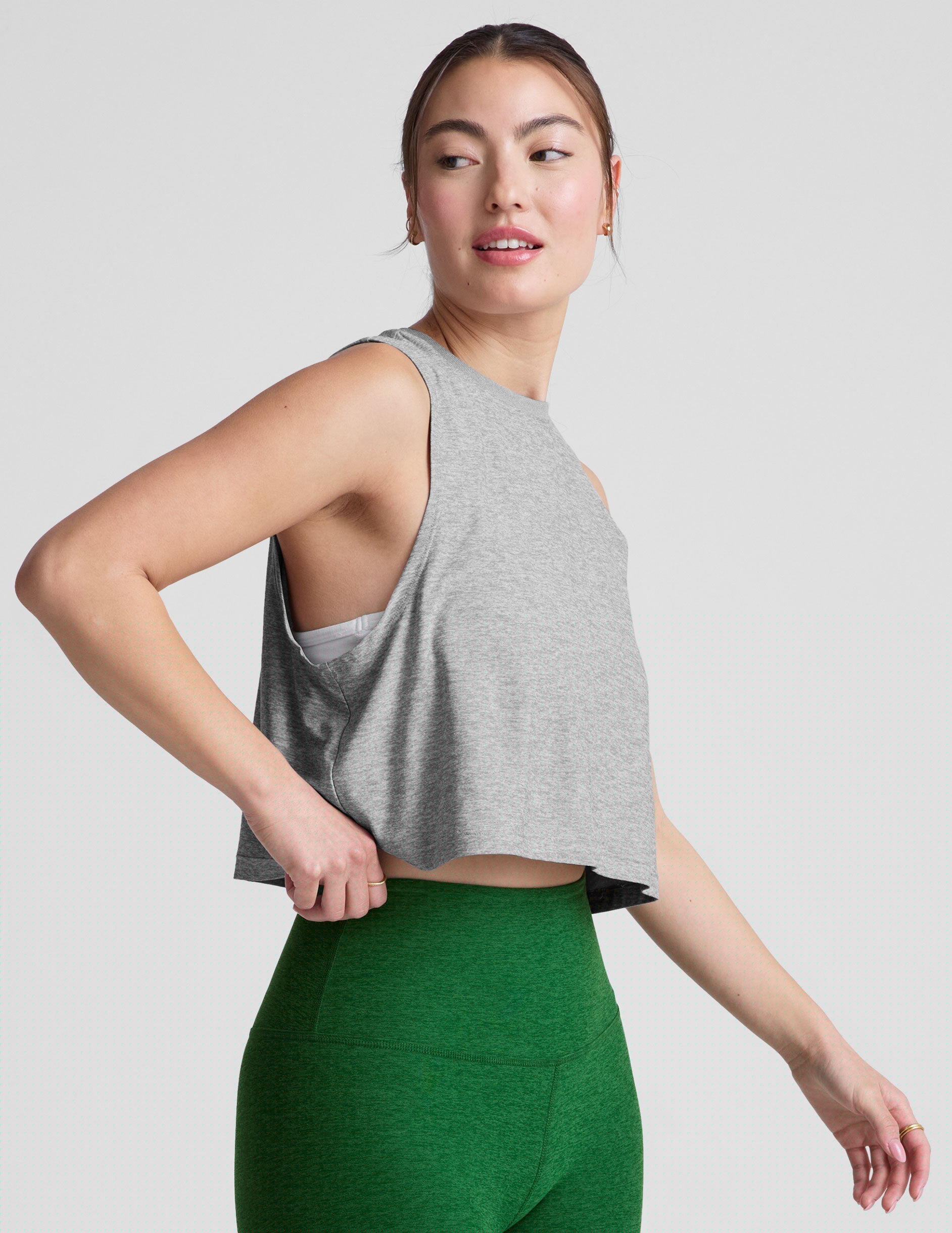 gray relaxed fit cropped tank with a scooped, ribbed neckline and ribbed arm holes.