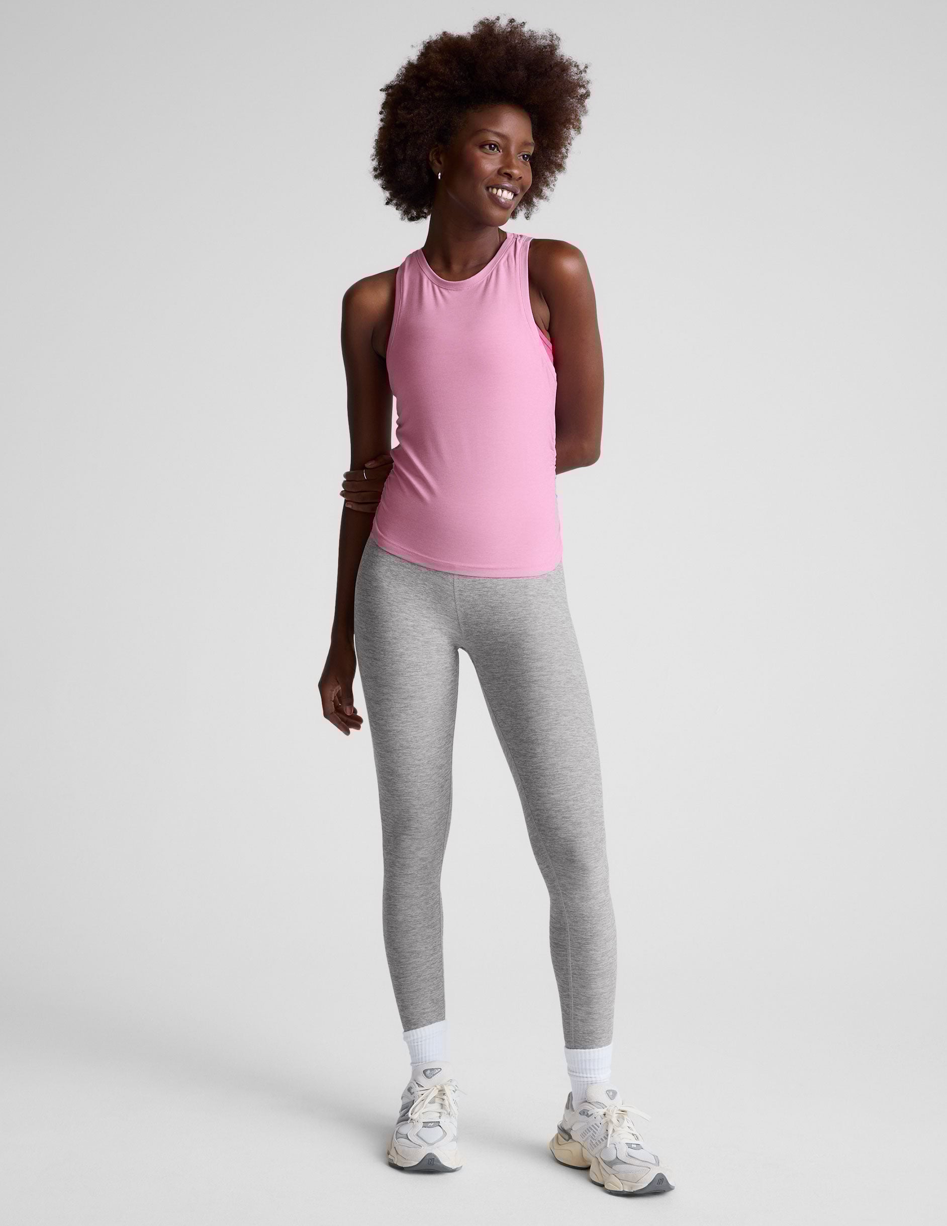 pink scoop neck tank top with shirred detailing on the sides.