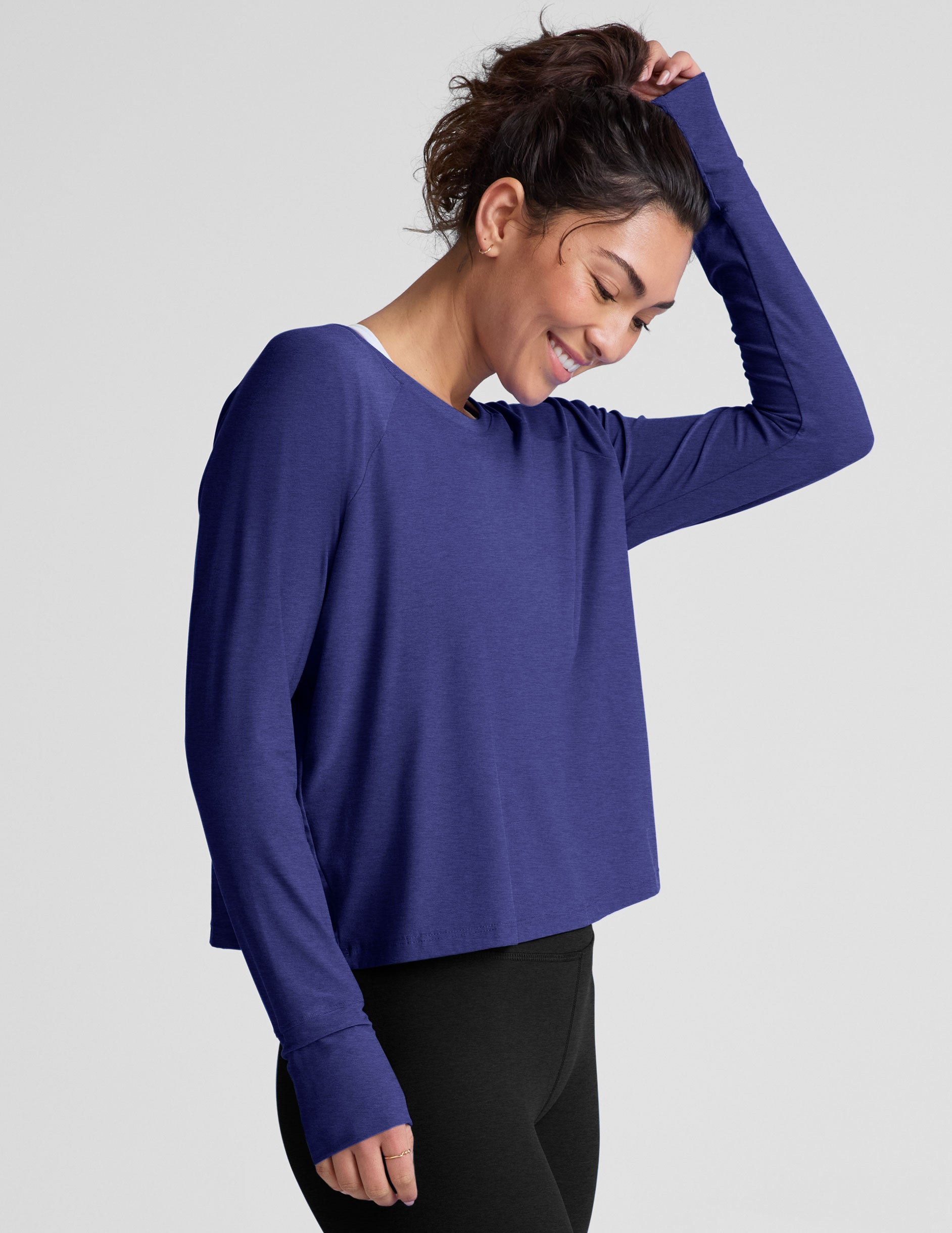blue long sleeve lightweight top with a crew neckline.