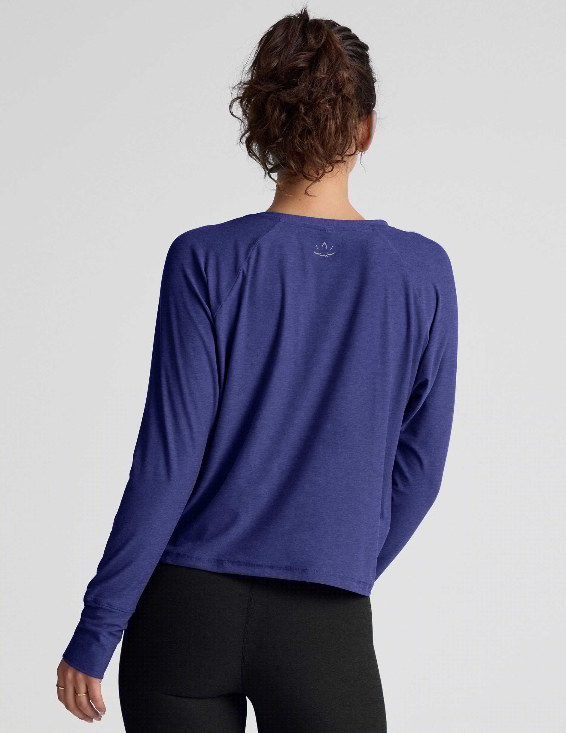 blue long sleeve lightweight top with a crew neckline.