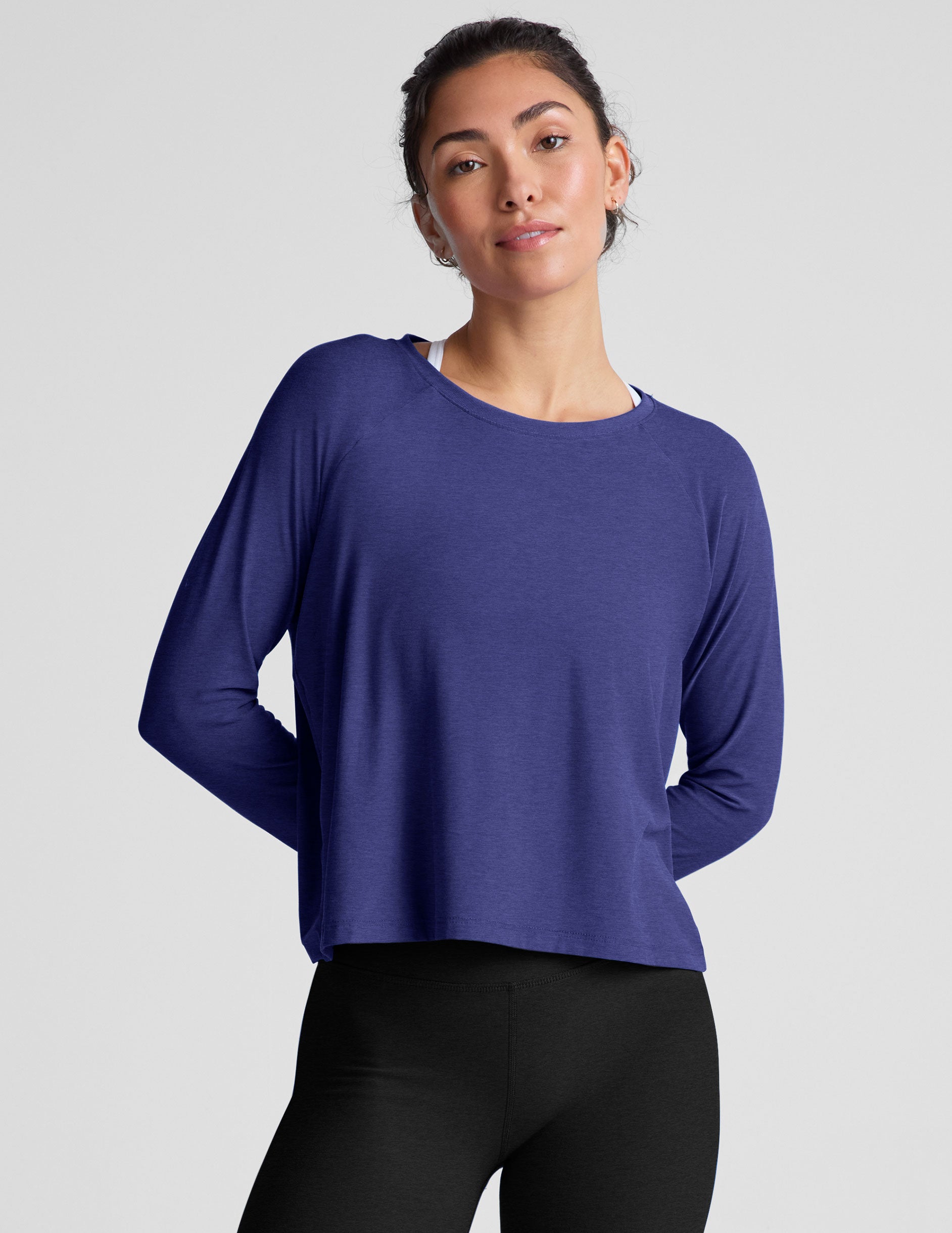 blue long sleeve lightweight top with a crew neckline.