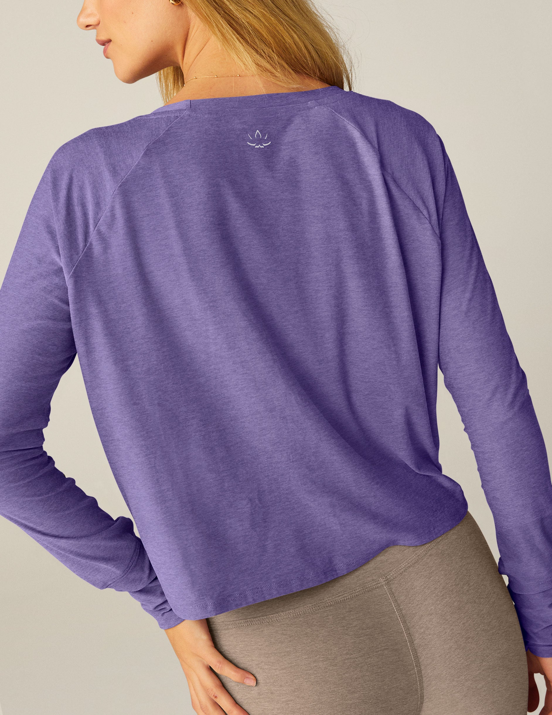 purple long sleeve crew neck top.