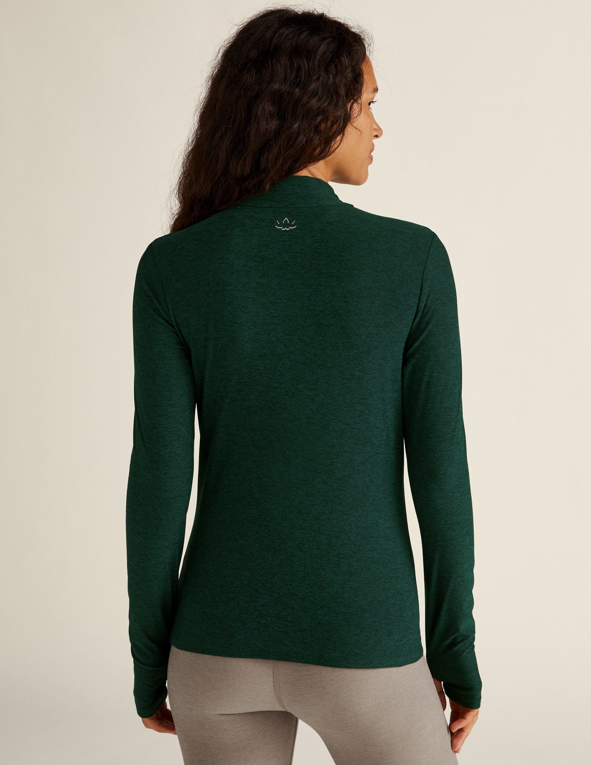 green mock neck long sleeve top with thumb holes.
