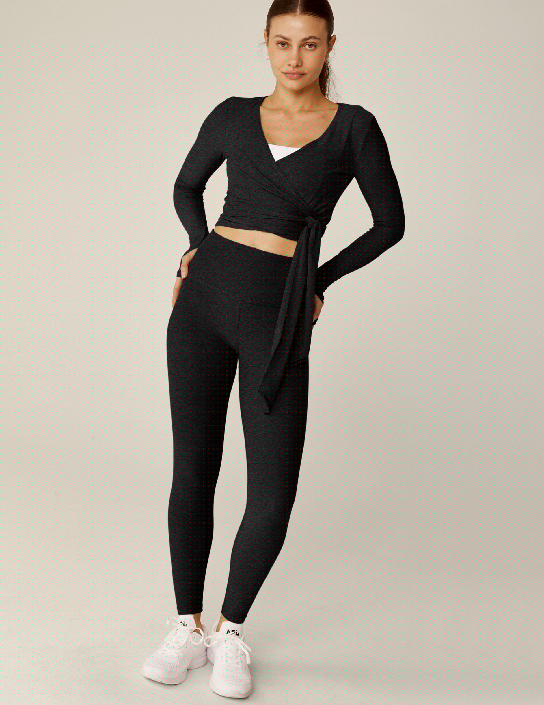 black v-neck tie wrap top with thumbholes.