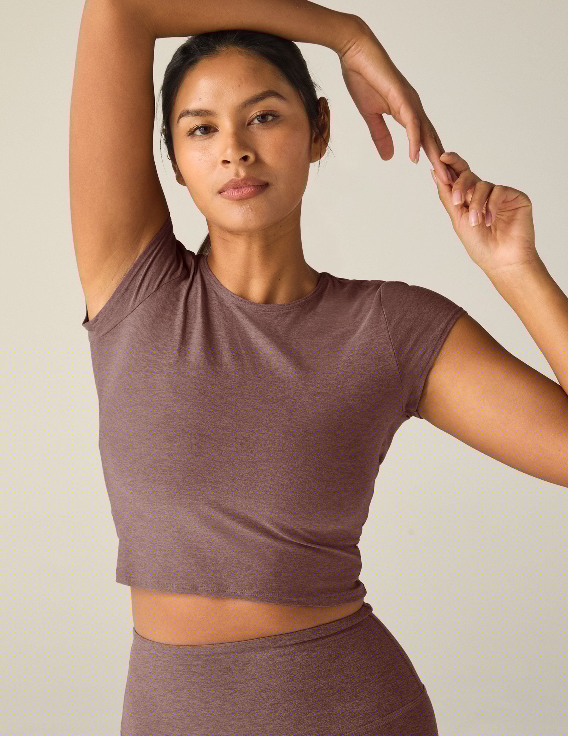 red short sleeve cropped t-shirt with a cutout detail on back.