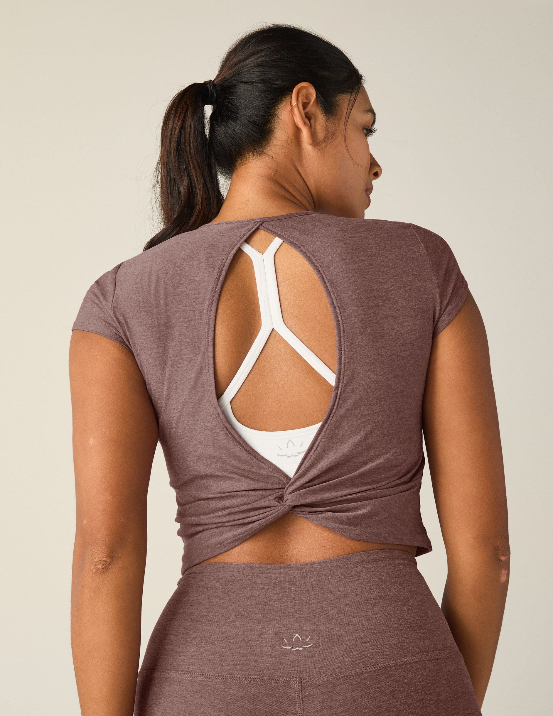 red short sleeve cropped t-shirt with a cutout detail on back.