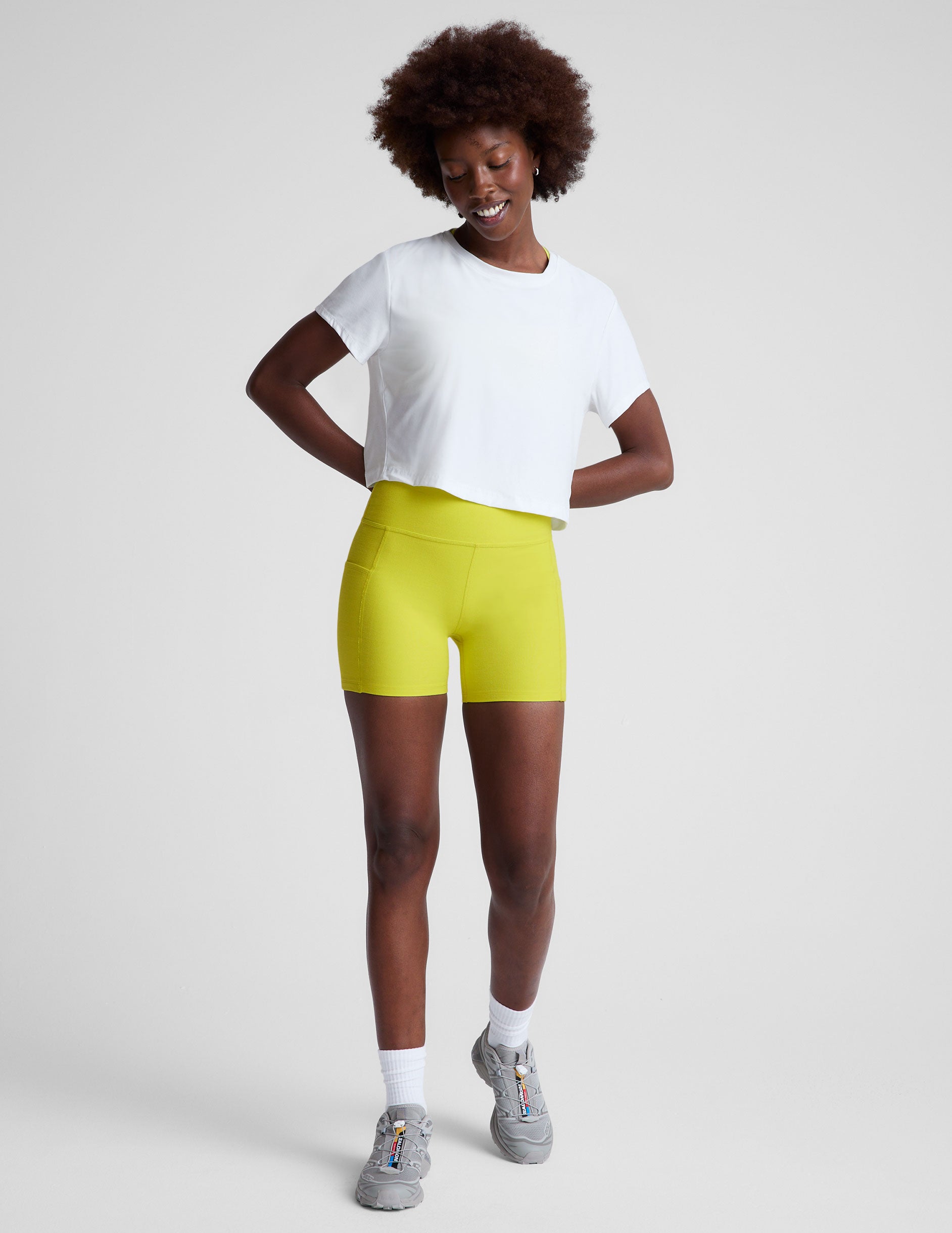 white lightweight loose-fitting cropped tee with a scoop neckline.