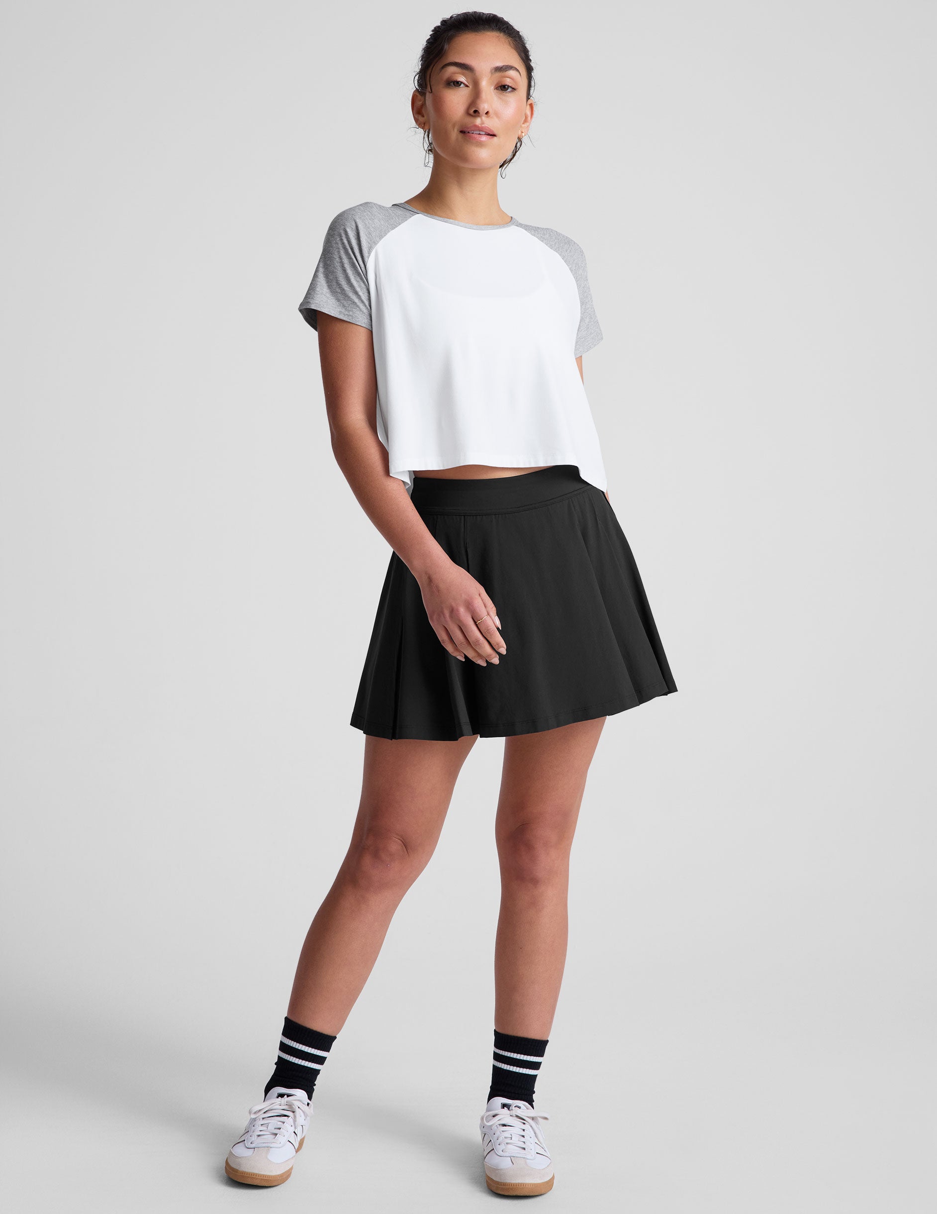 white relaxed fit t-shirt with colorblock raglan sleeve and neck binding.