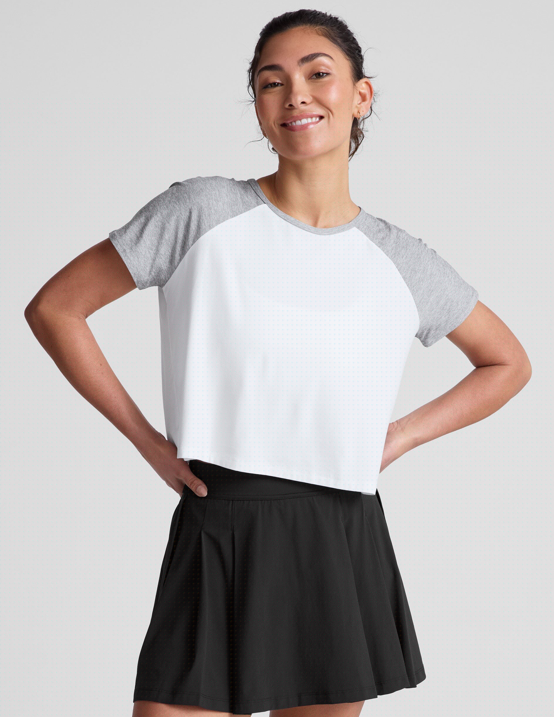white relaxed fit t-shirt with colorblock raglan sleeve and neck binding.