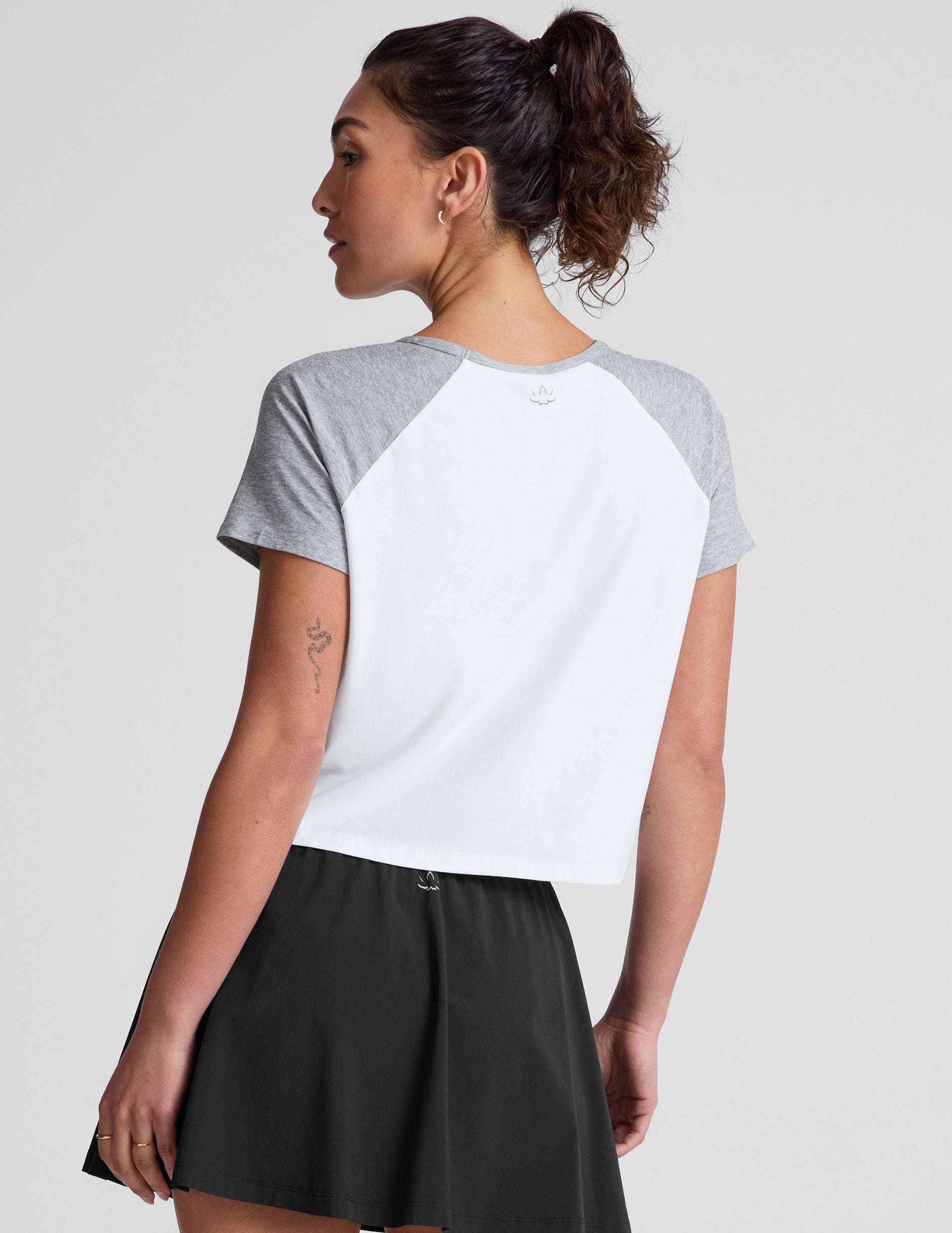 white relaxed fit t-shirt with colorblock raglan sleeve and neck binding.