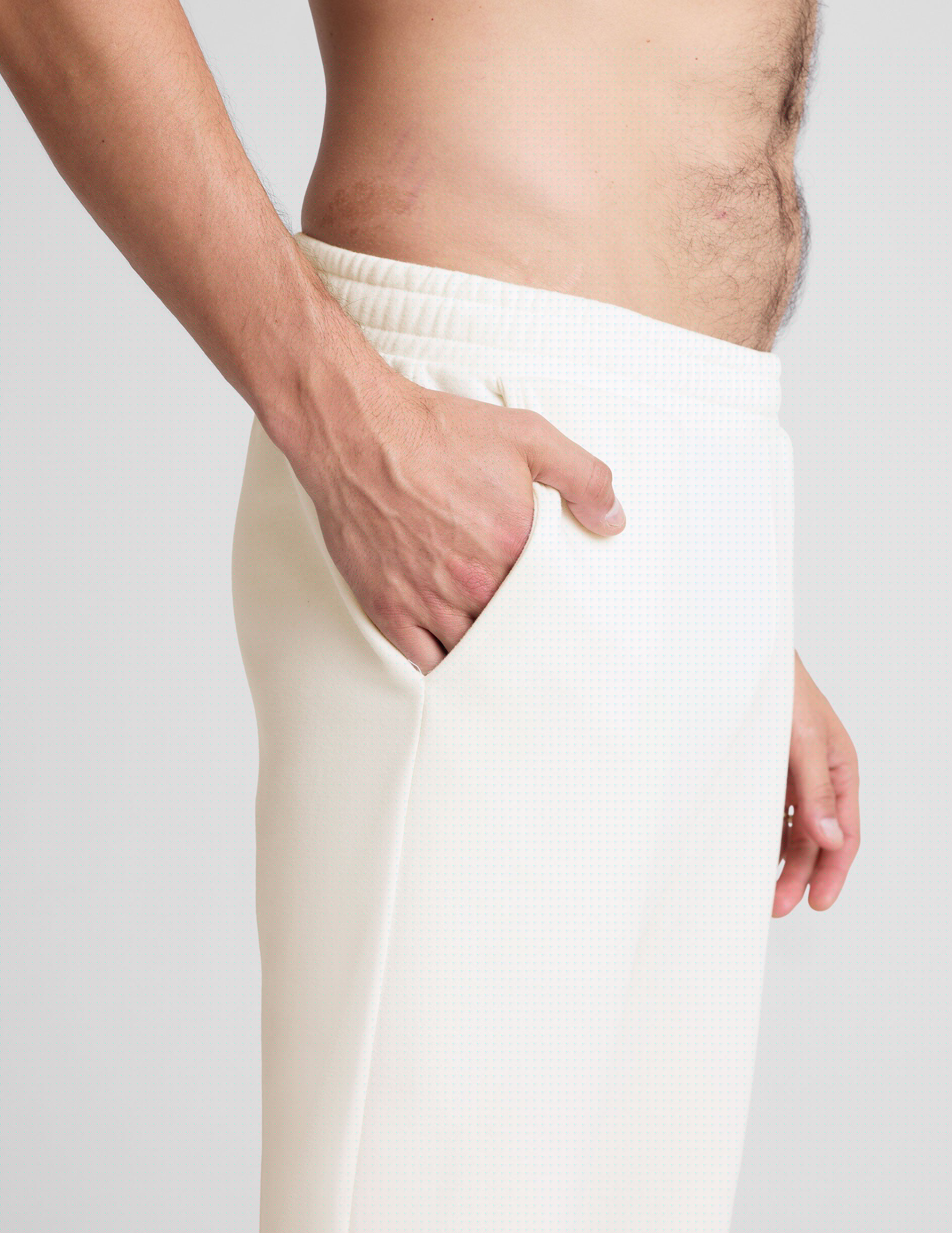 white men's sweatpants with a drawstring at waistband.