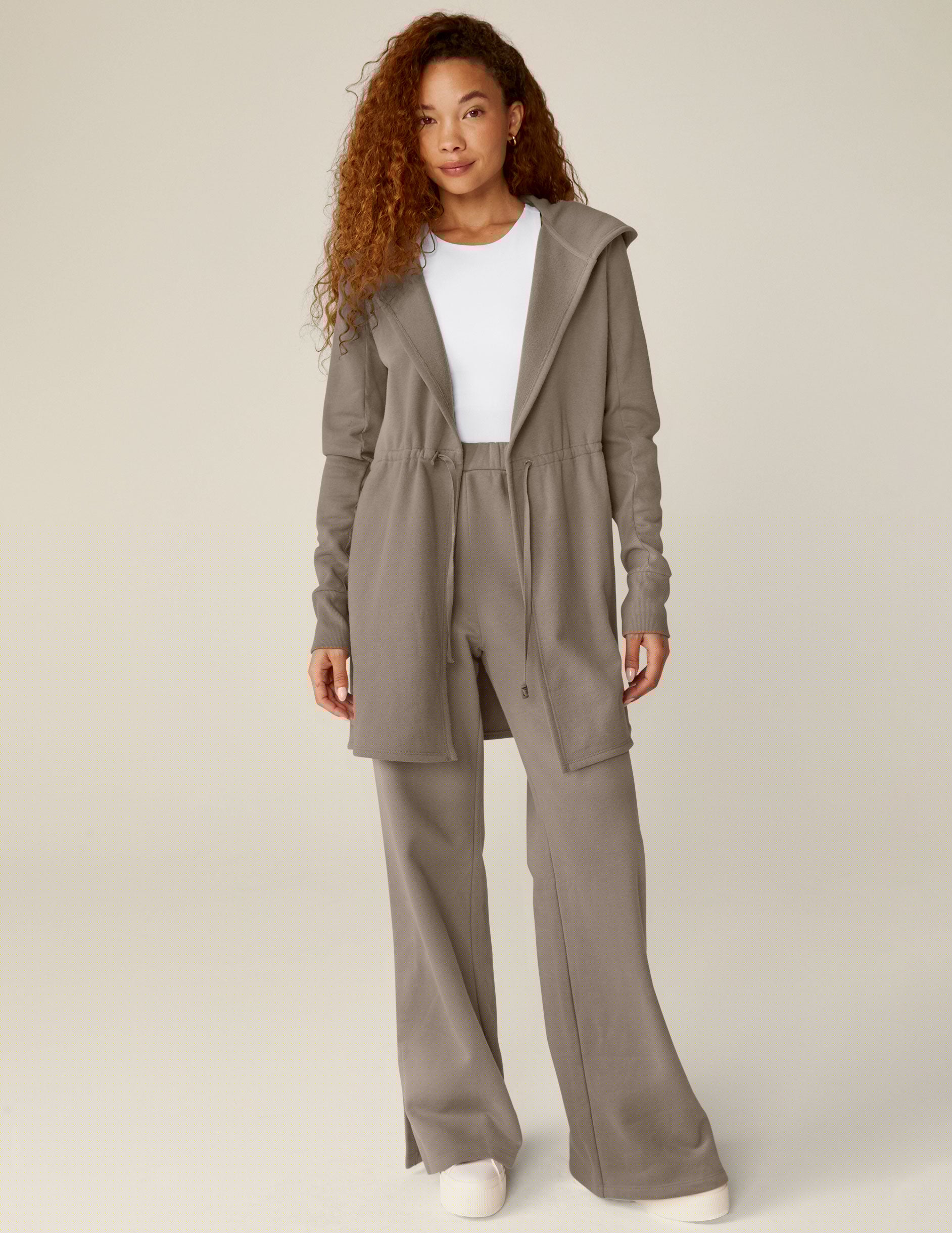 brown hooded jacket with a cinched waistband.