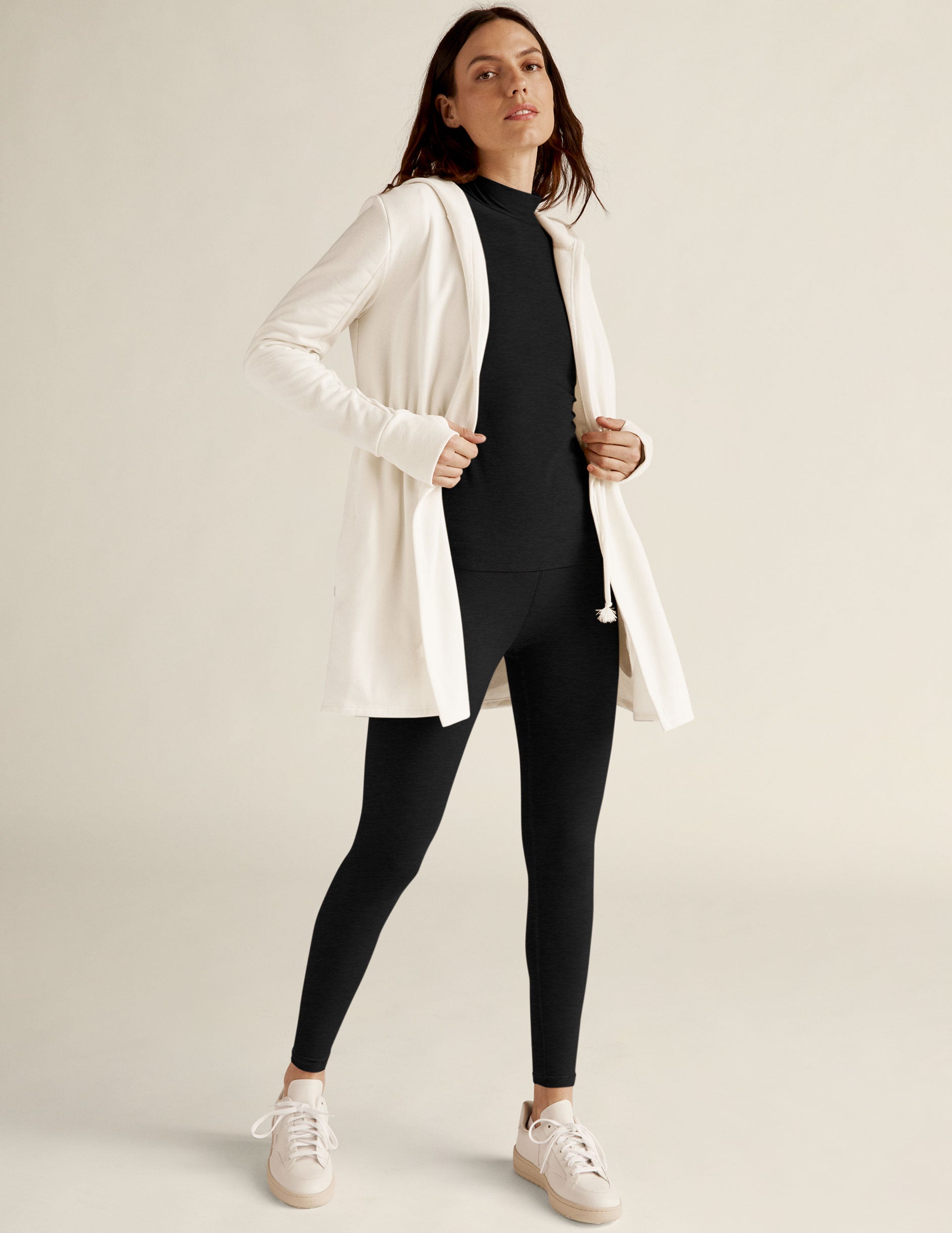 white jacket with drawstring at waist.