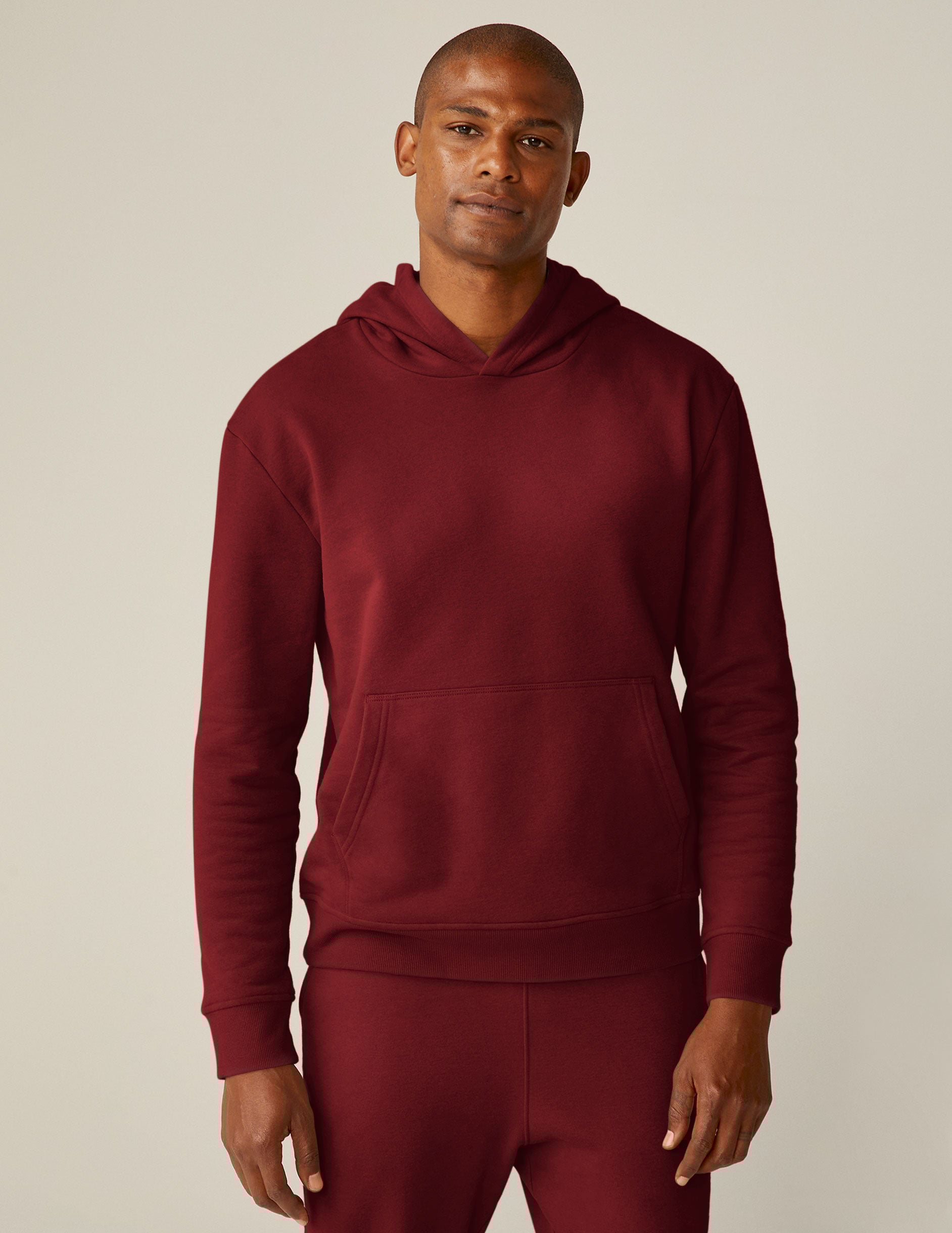 red pullover hoodie with a kangaroo pocket.