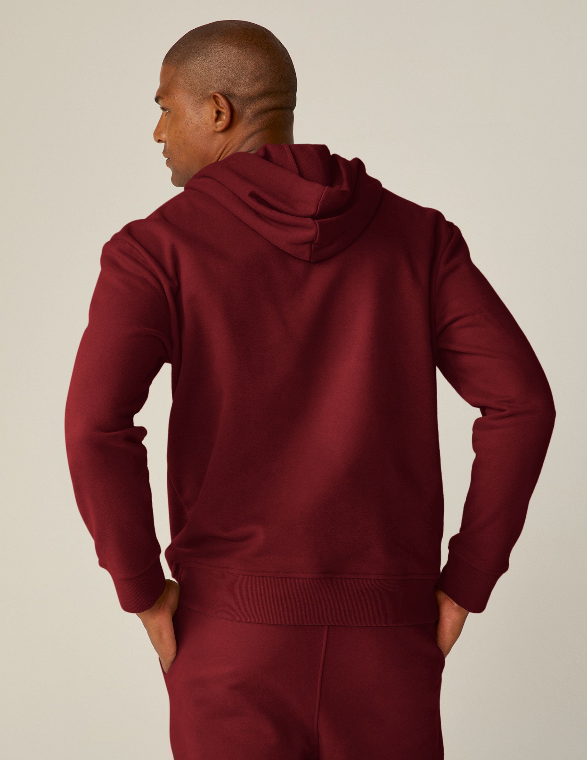 red pullover hoodie with a kangaroo pocket.