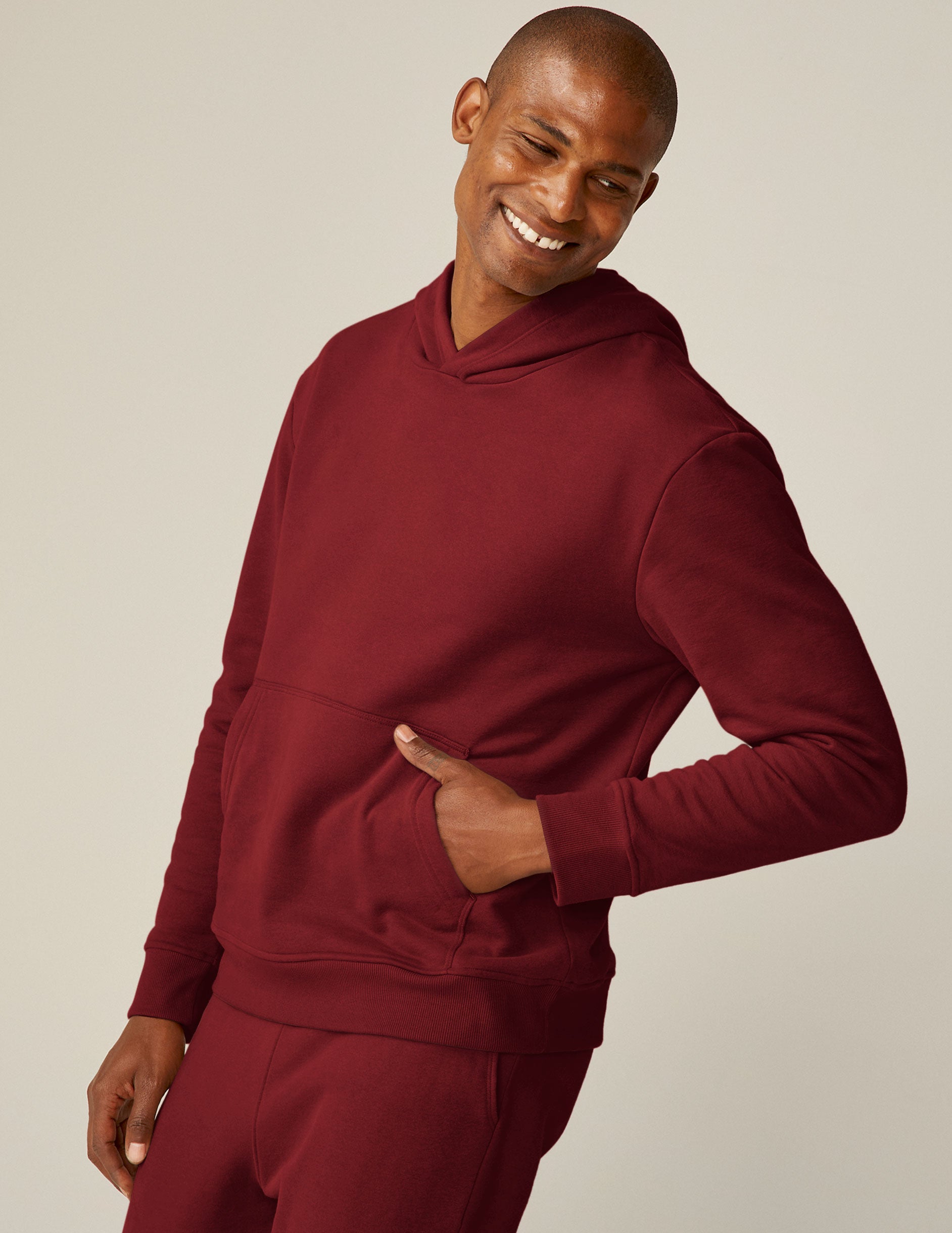 red pullover hoodie with a kangaroo pocket.
