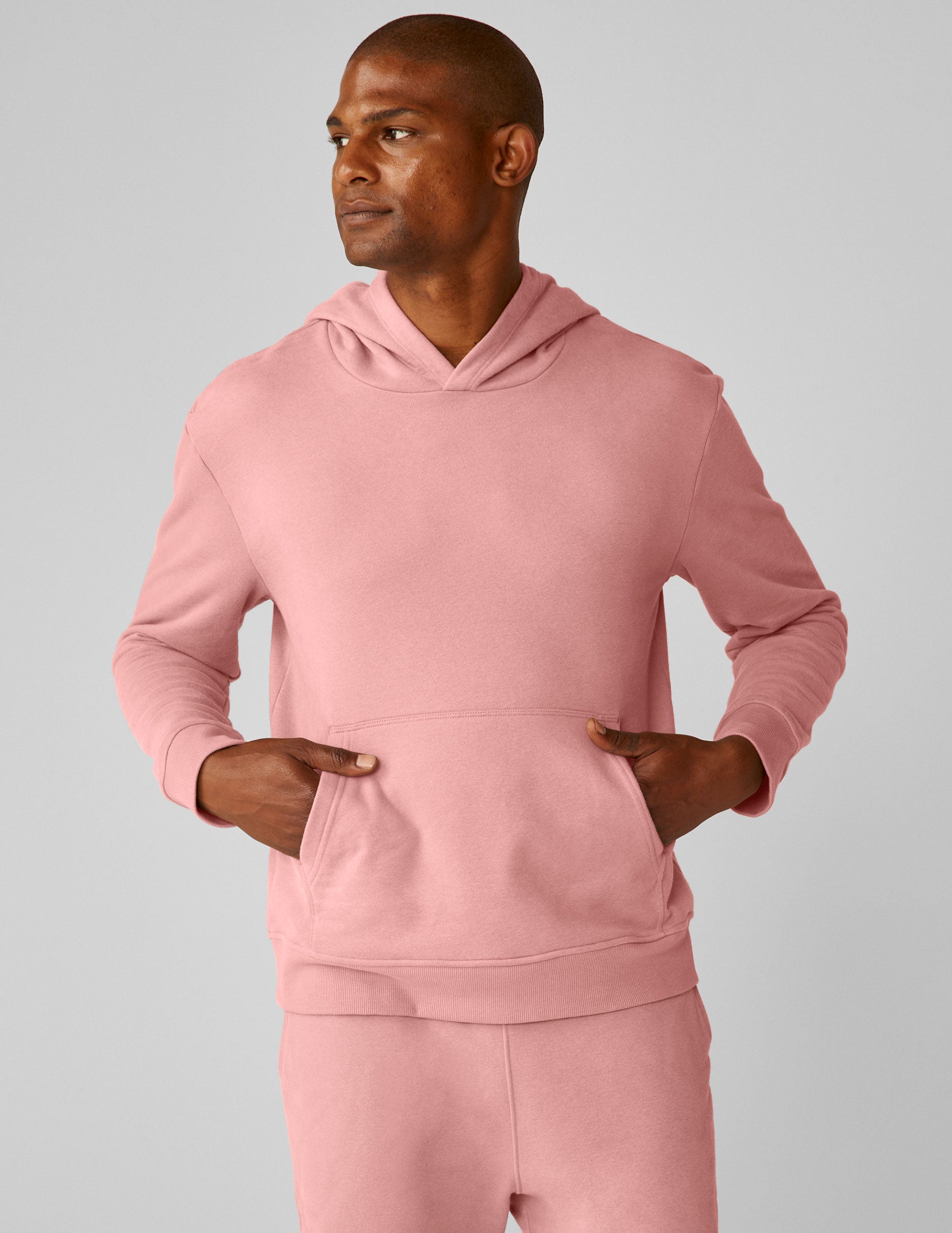 pink men's pullover hoodie with a kangaroo pocket.