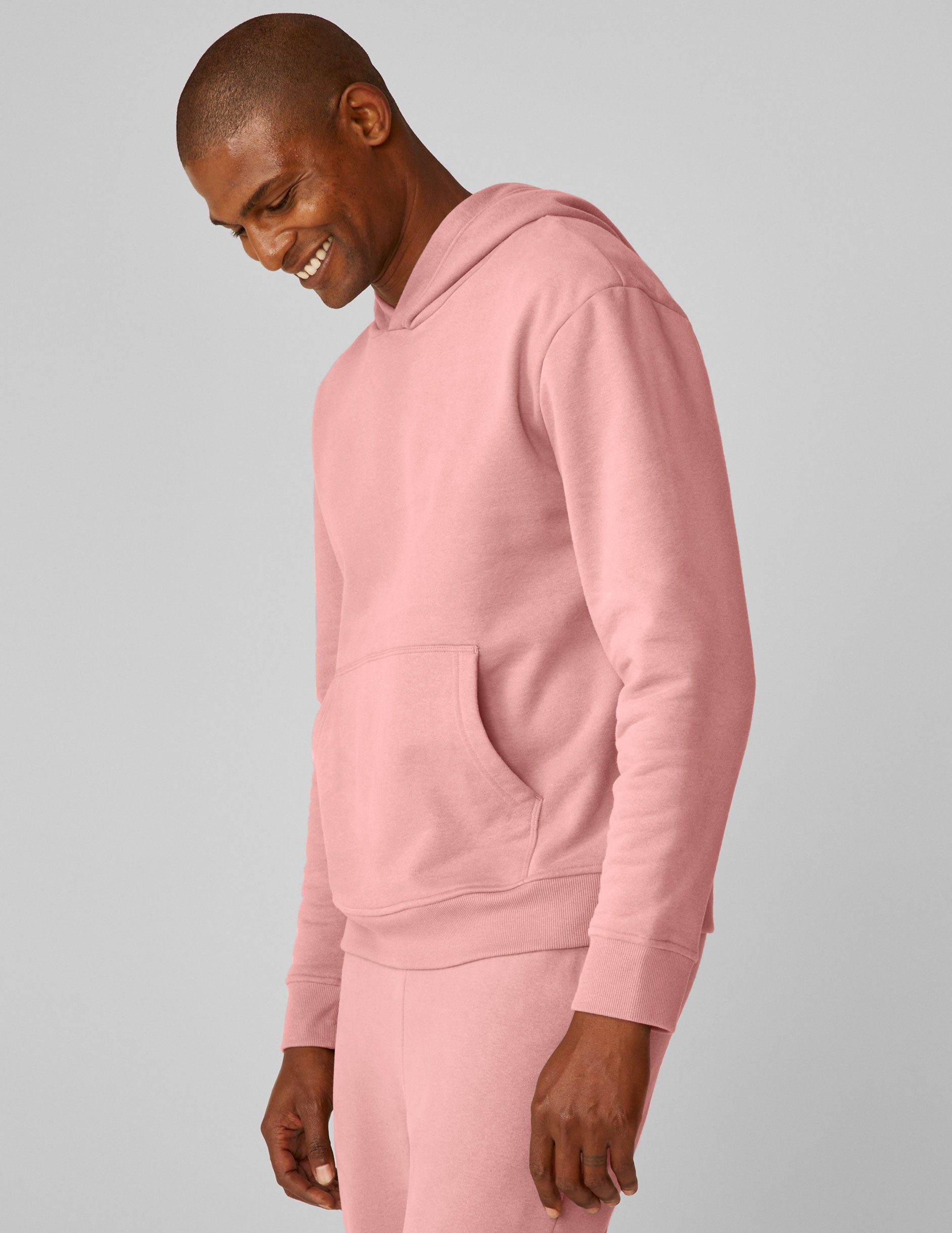 pink men's pullover hoodie with a kangaroo pocket.
