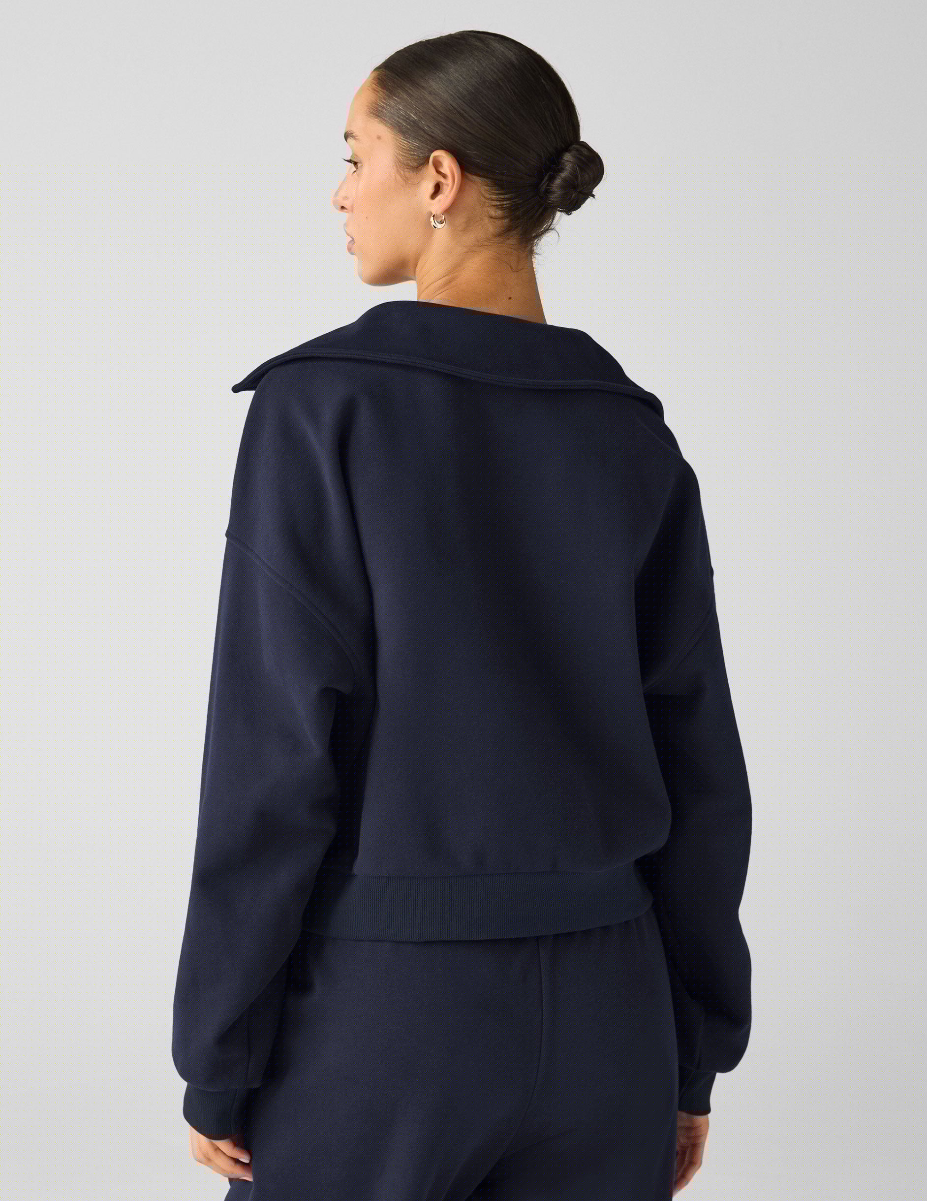 blue pullover sweater with a collar and kangaroo pocket.