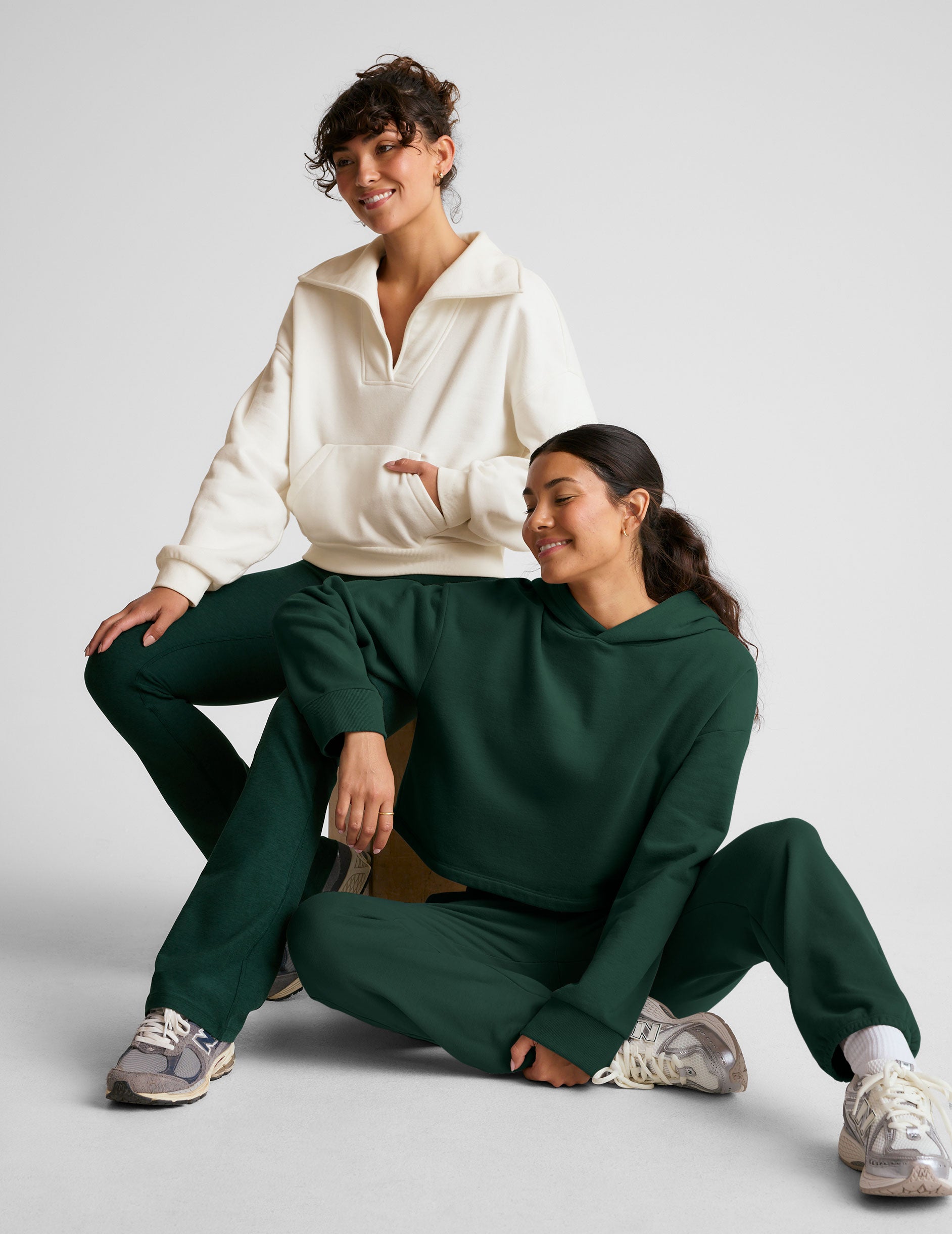 white pullover sweatshirt with a collar and kangaroo pocket.