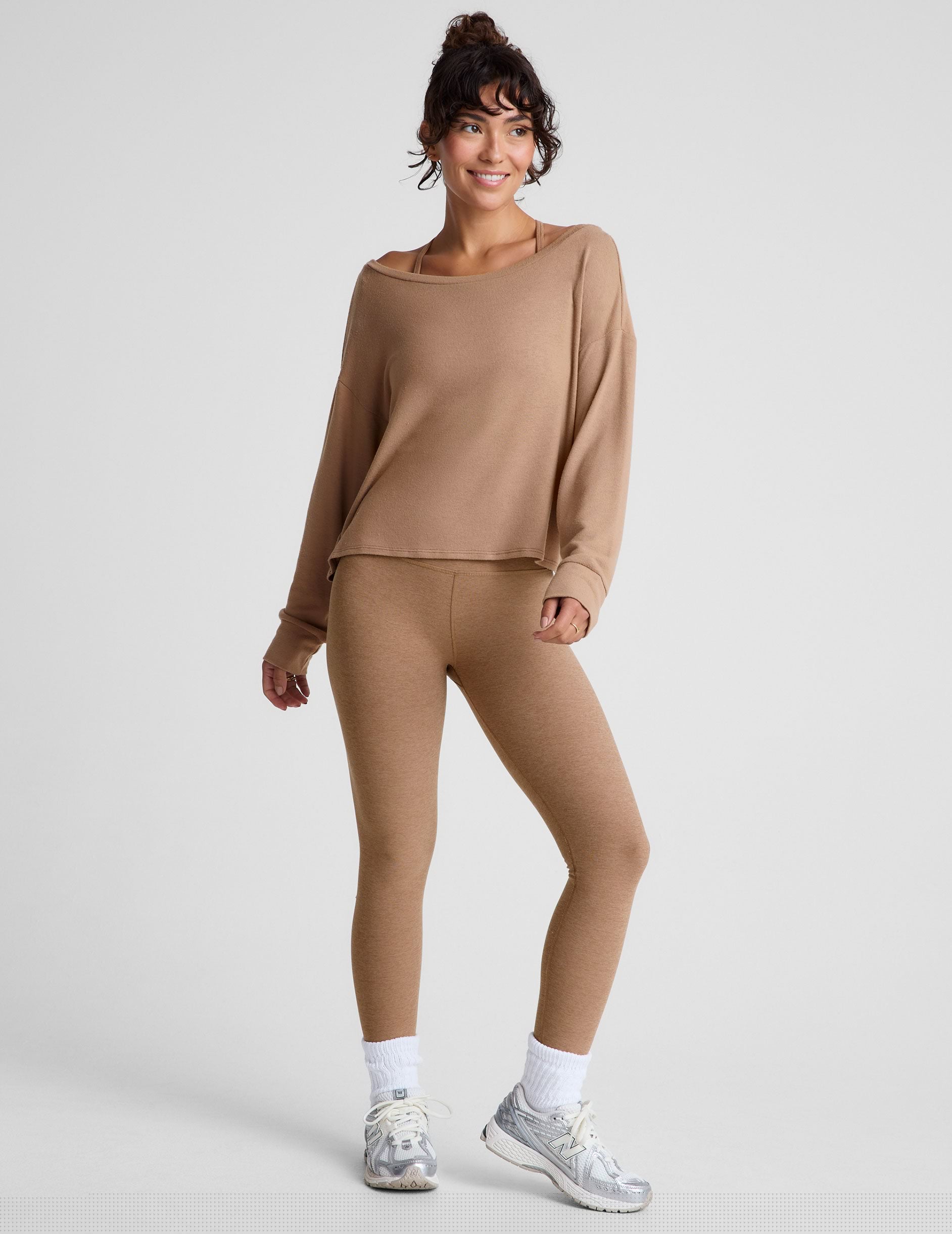 brown classic length long sleeve sweater with a wide off-the-shoulder neckline.