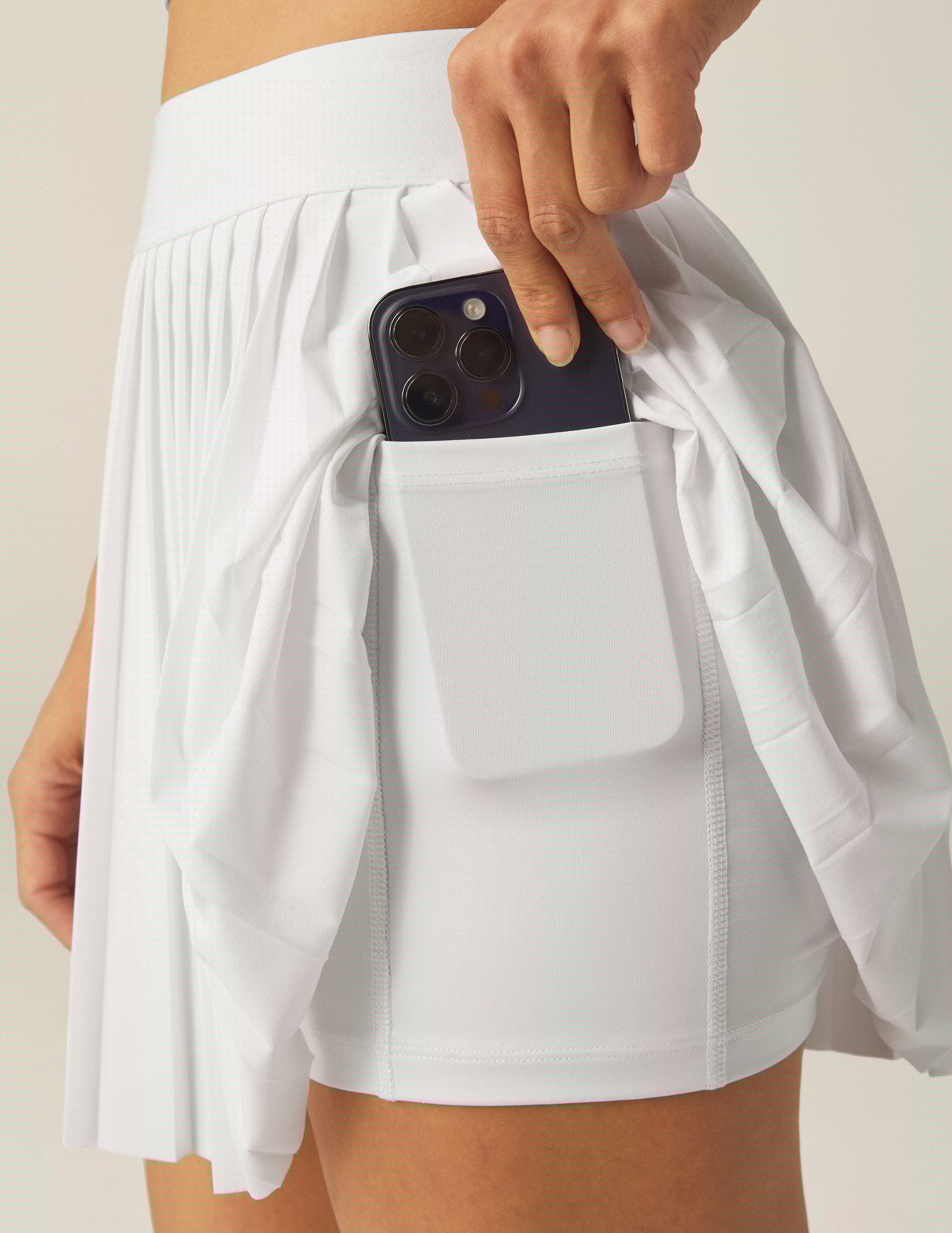 white pleated mini skirt with shorts underneath