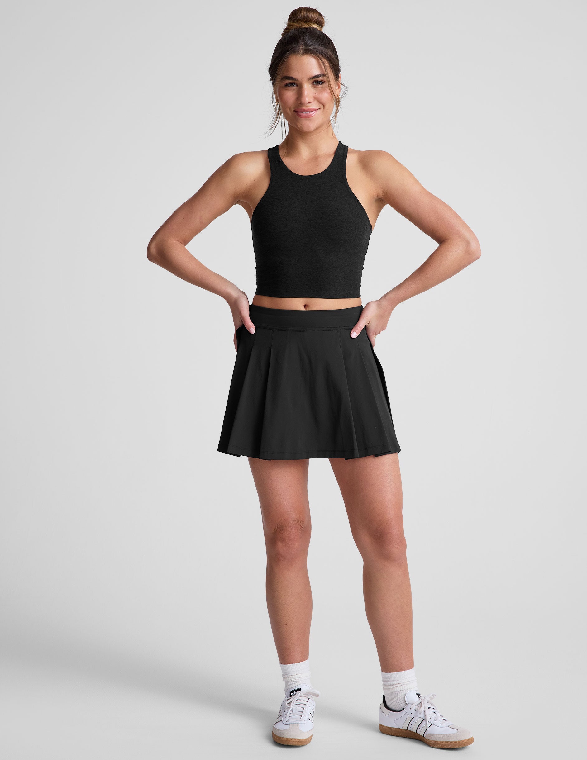 black mini pleated skirt with interior shorts with pockets.