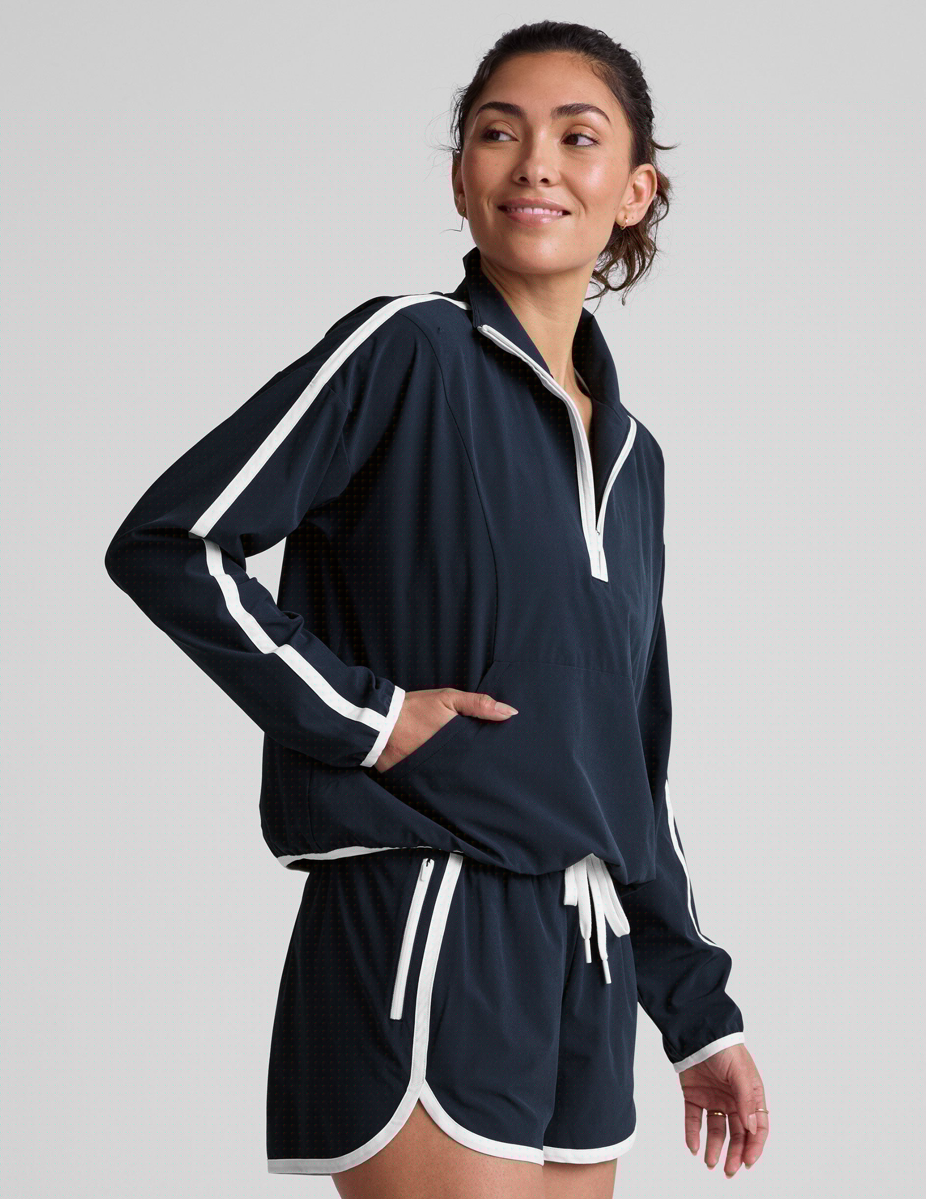 blue pullover with a half zip front and front kangaroo pocket.