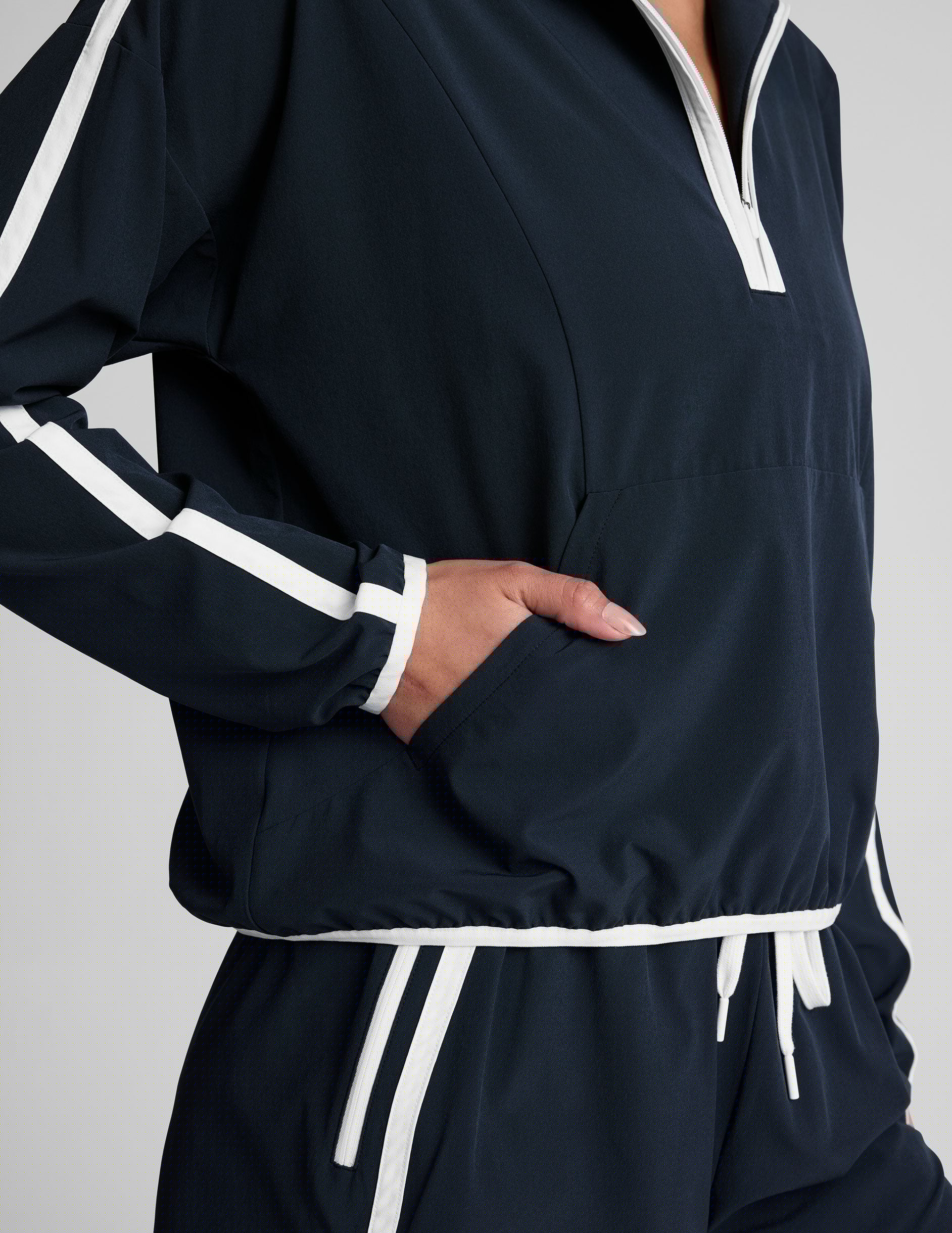 blue pullover with a half zip front and front kangaroo pocket.