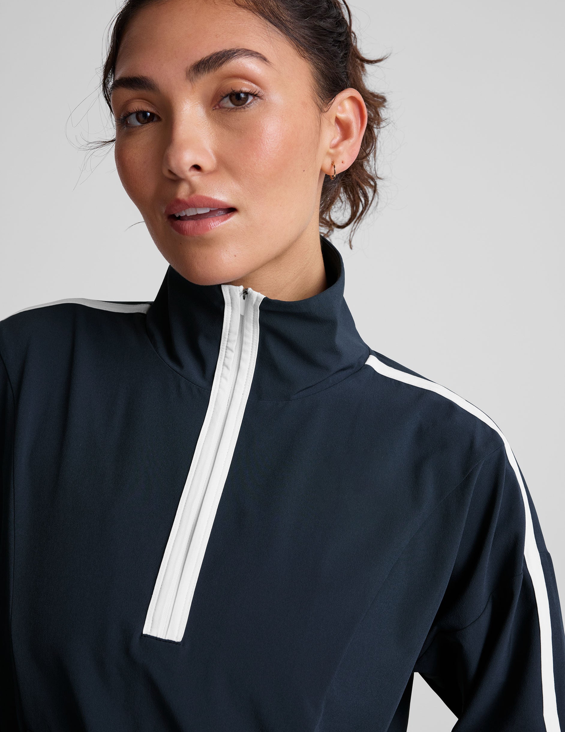 blue pullover with a half zip front and front kangaroo pocket.