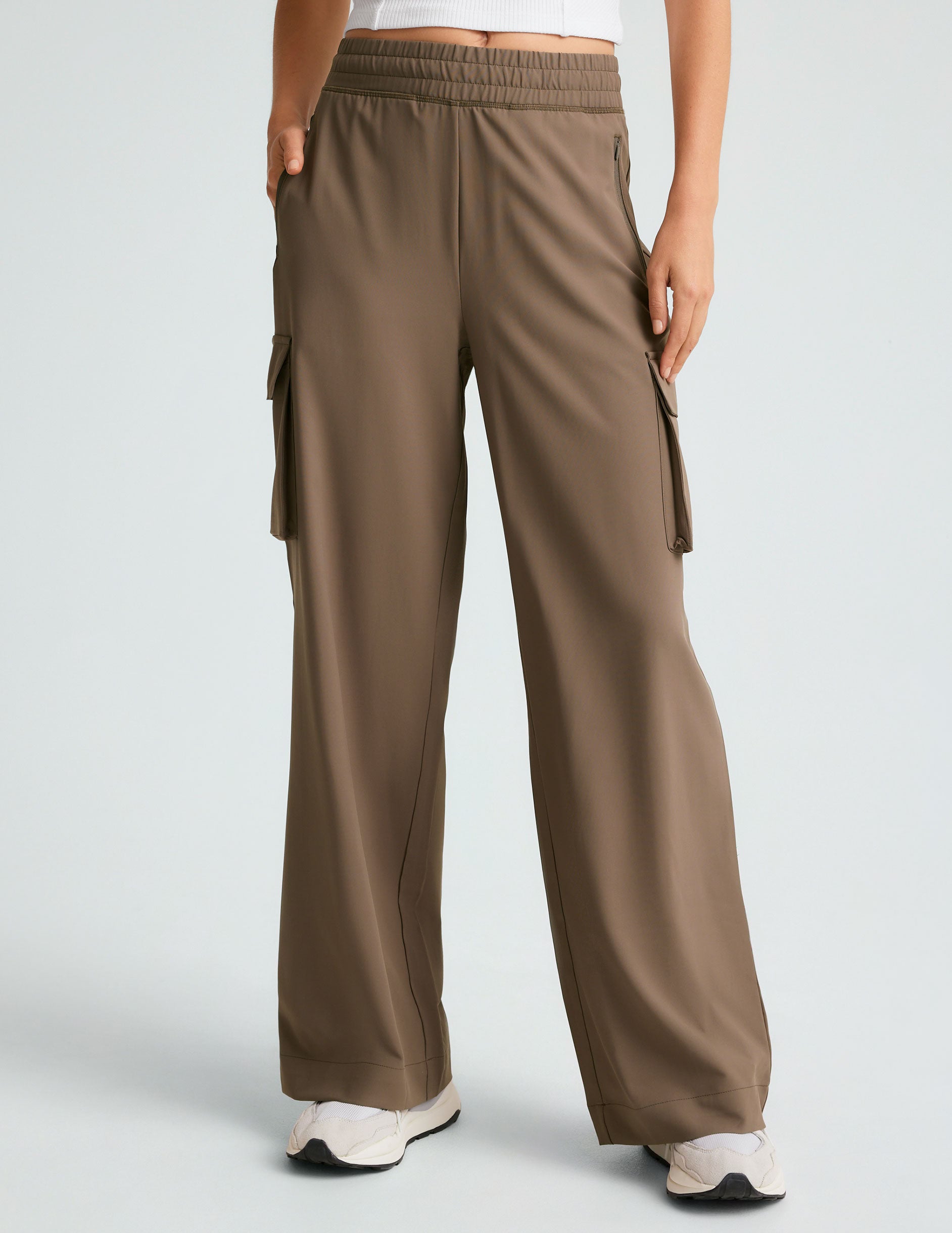 brown cargo style high-waisted pants with pockets.