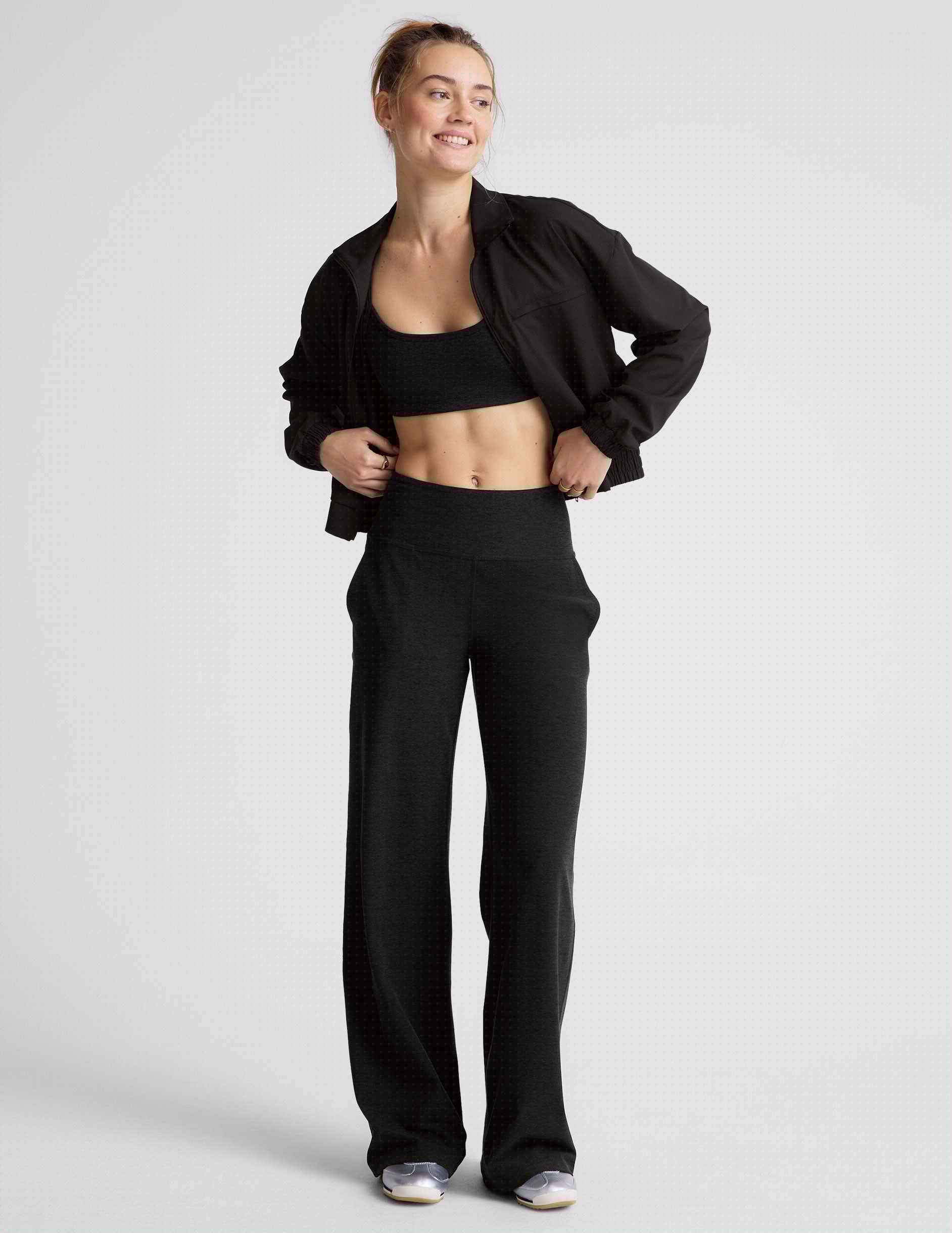 black zip-up jetstretch woven jacket with a collar.
