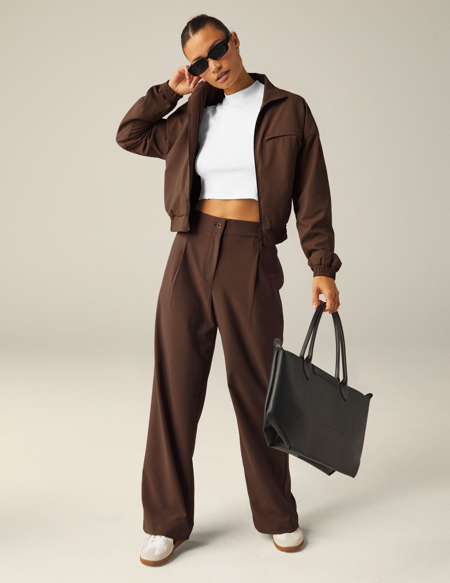 brown collared zip-up jacket with side pockets.