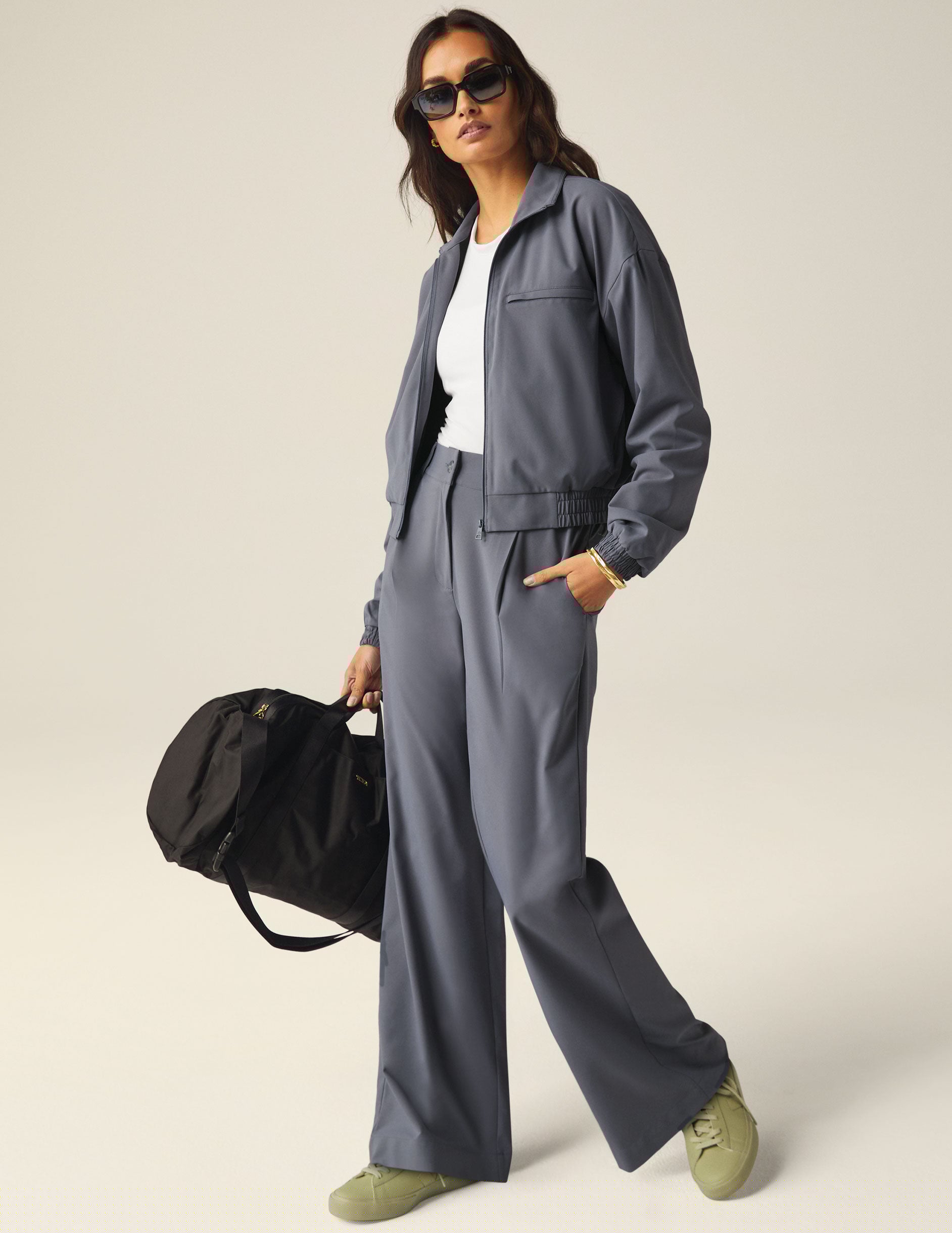 blue zip-up jetstretch woven jacket with pockets and a collar.