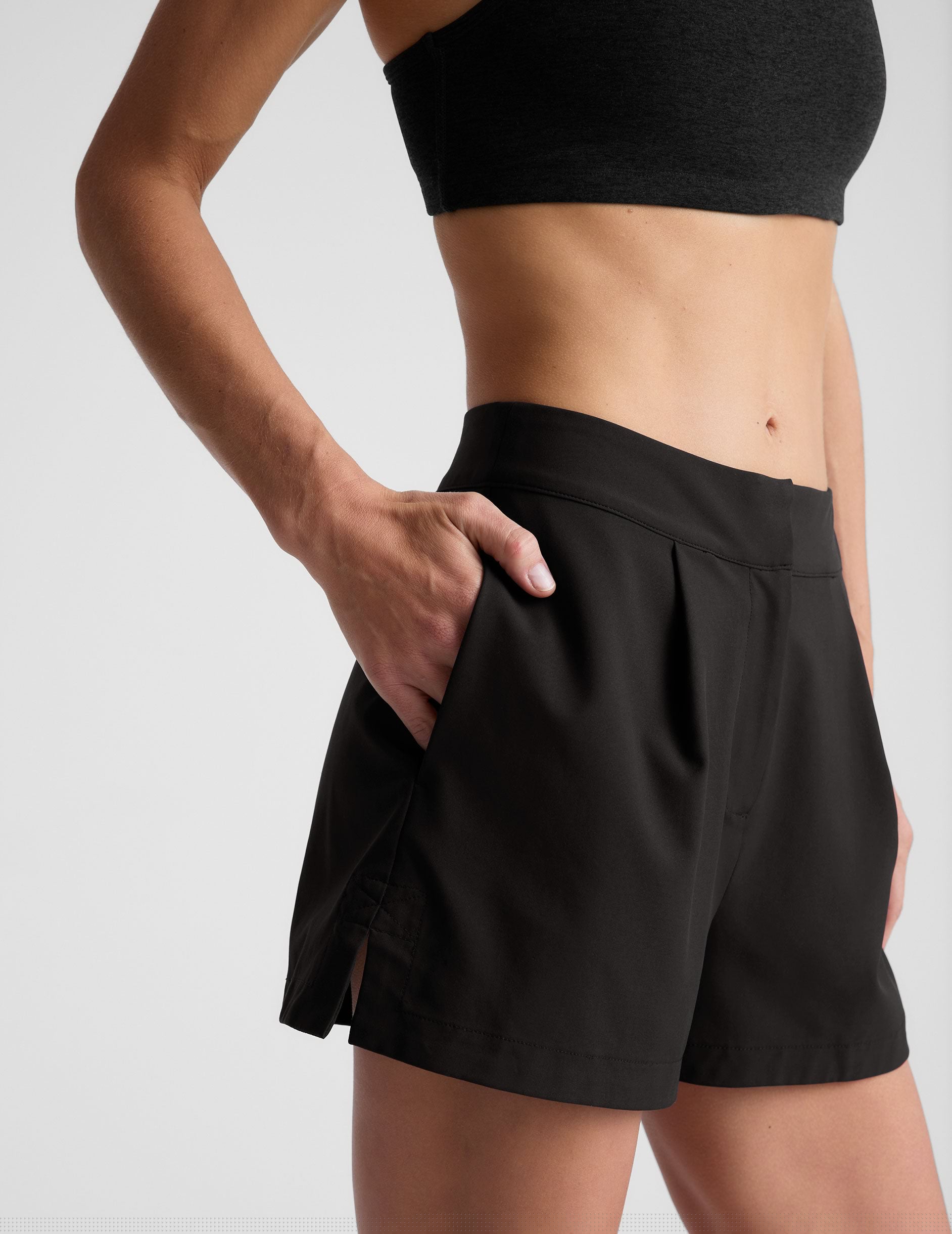 black high-waisted trouser shorts.