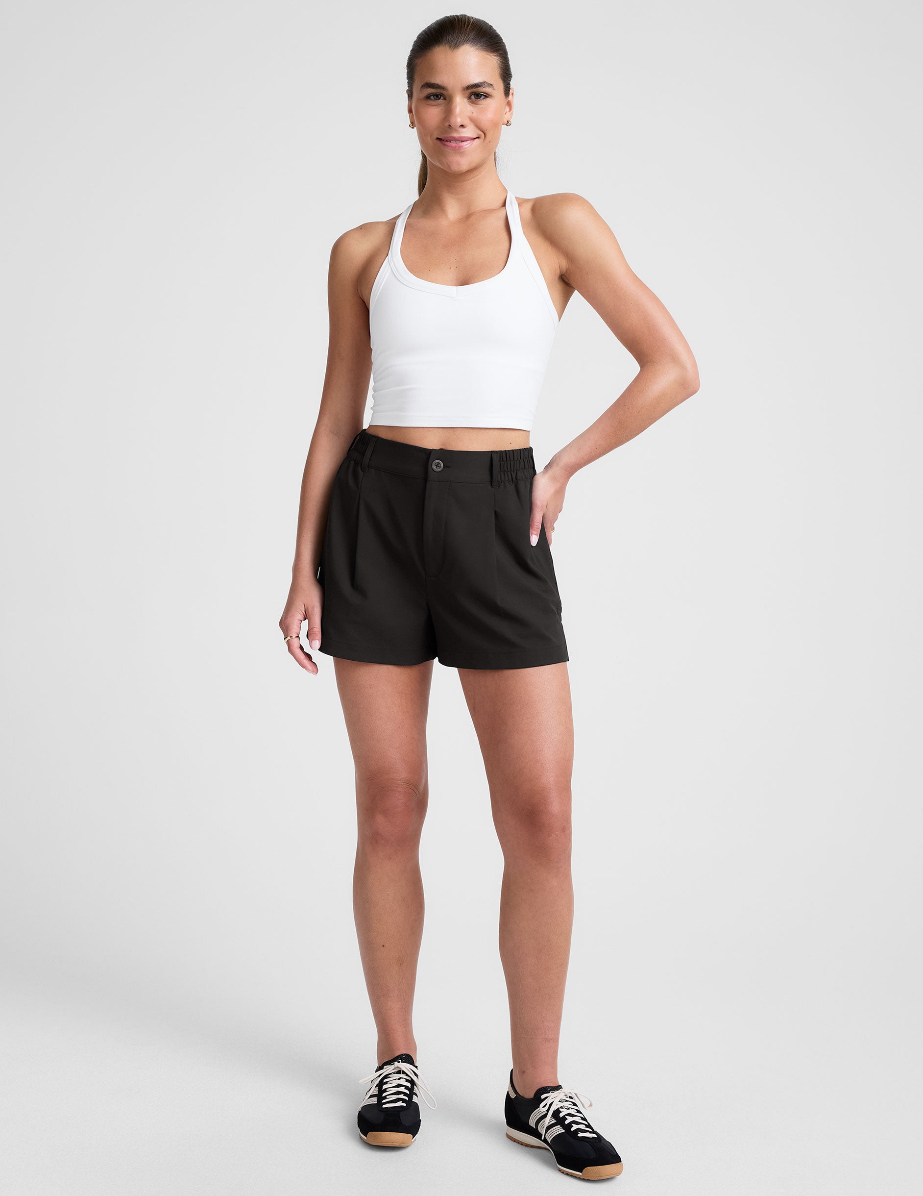 black 4" inseam shorts with an elastic waistband with belt loops and side seam pockets.